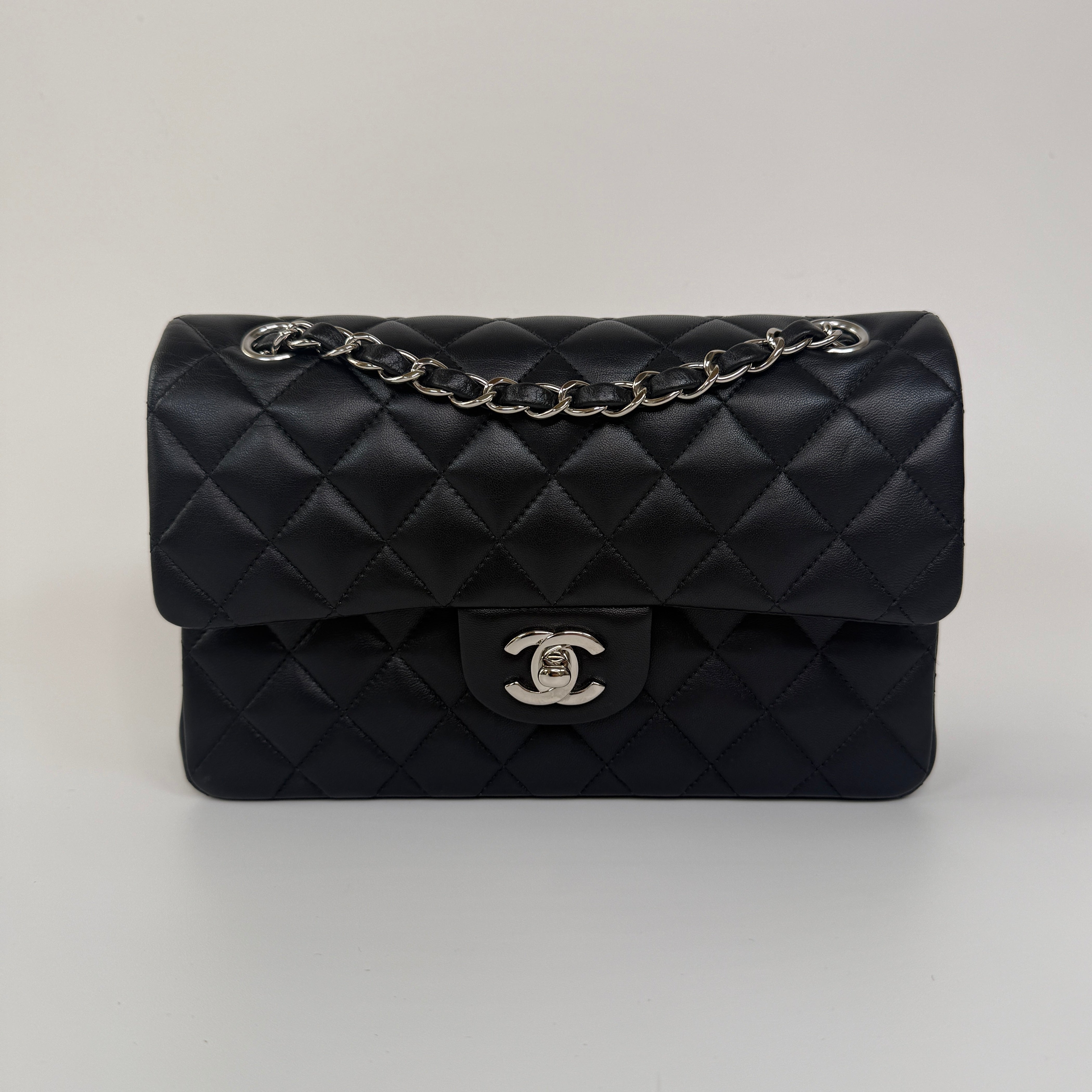 Chanel Small Classic Double Flap In Black Lambskin Leather With Silver Hardware Authentic and preloved in excellent condition. 100% Authenticity guarantee