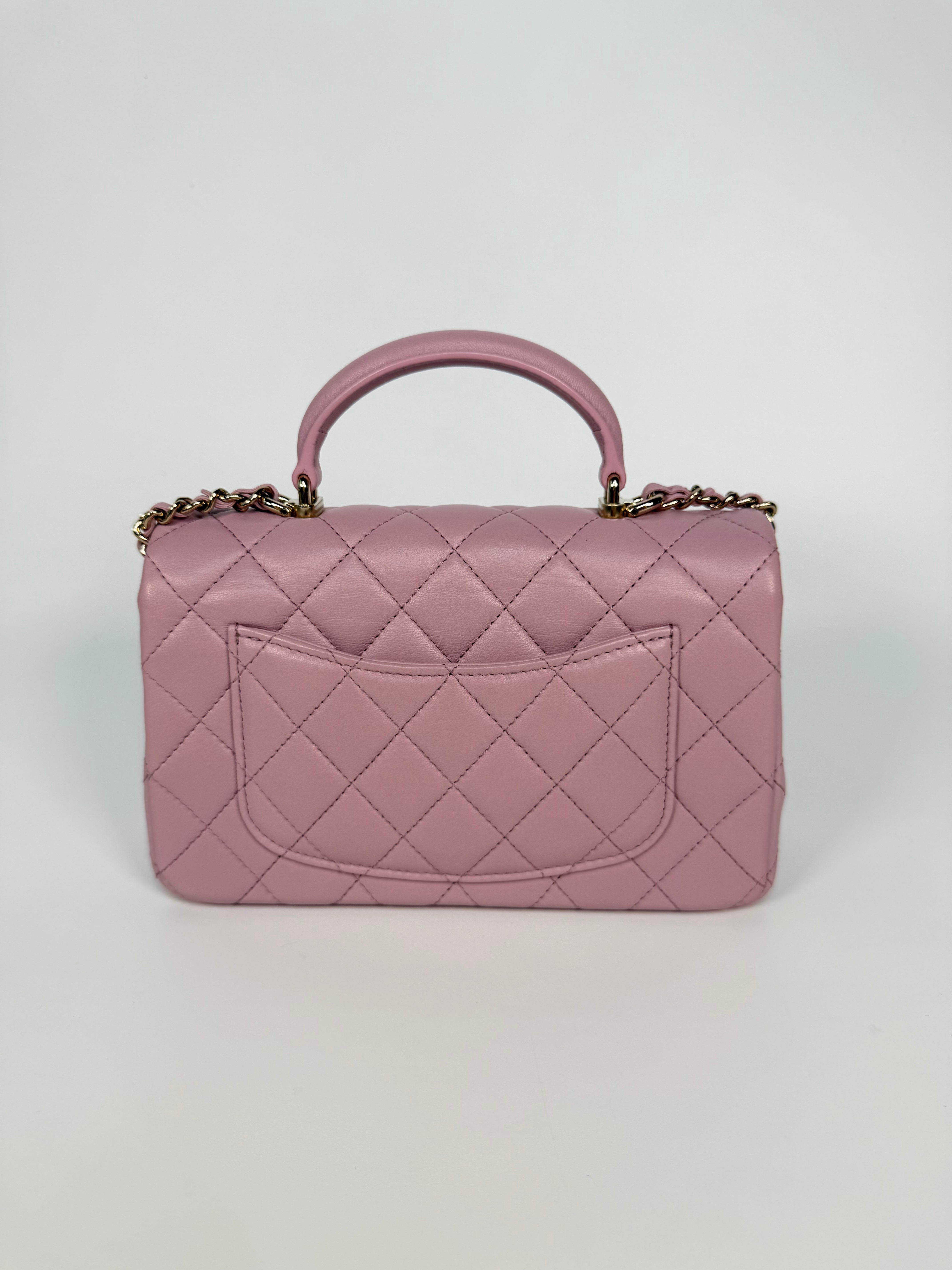 Chanel Mini Rectangle Top Handle In Pink Lambskin Leather With Pale Gold Hardware. 100% authentic and preloved in excellent condition