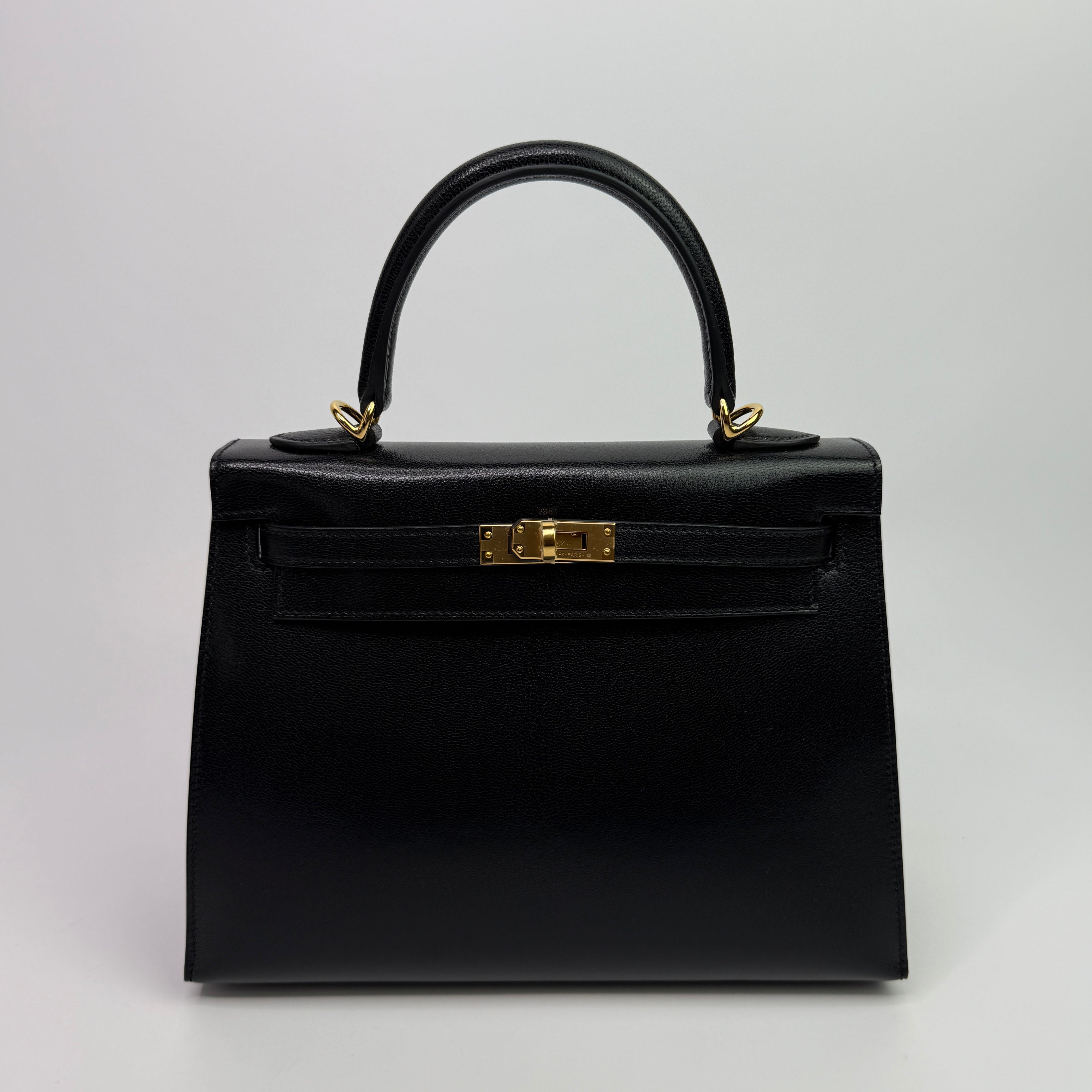Authentic Pre Loved Hermès Kelly 25 Sellier In Black Chevre Chamilka Leather with Yellow Gold Hardware New & Unused Condition