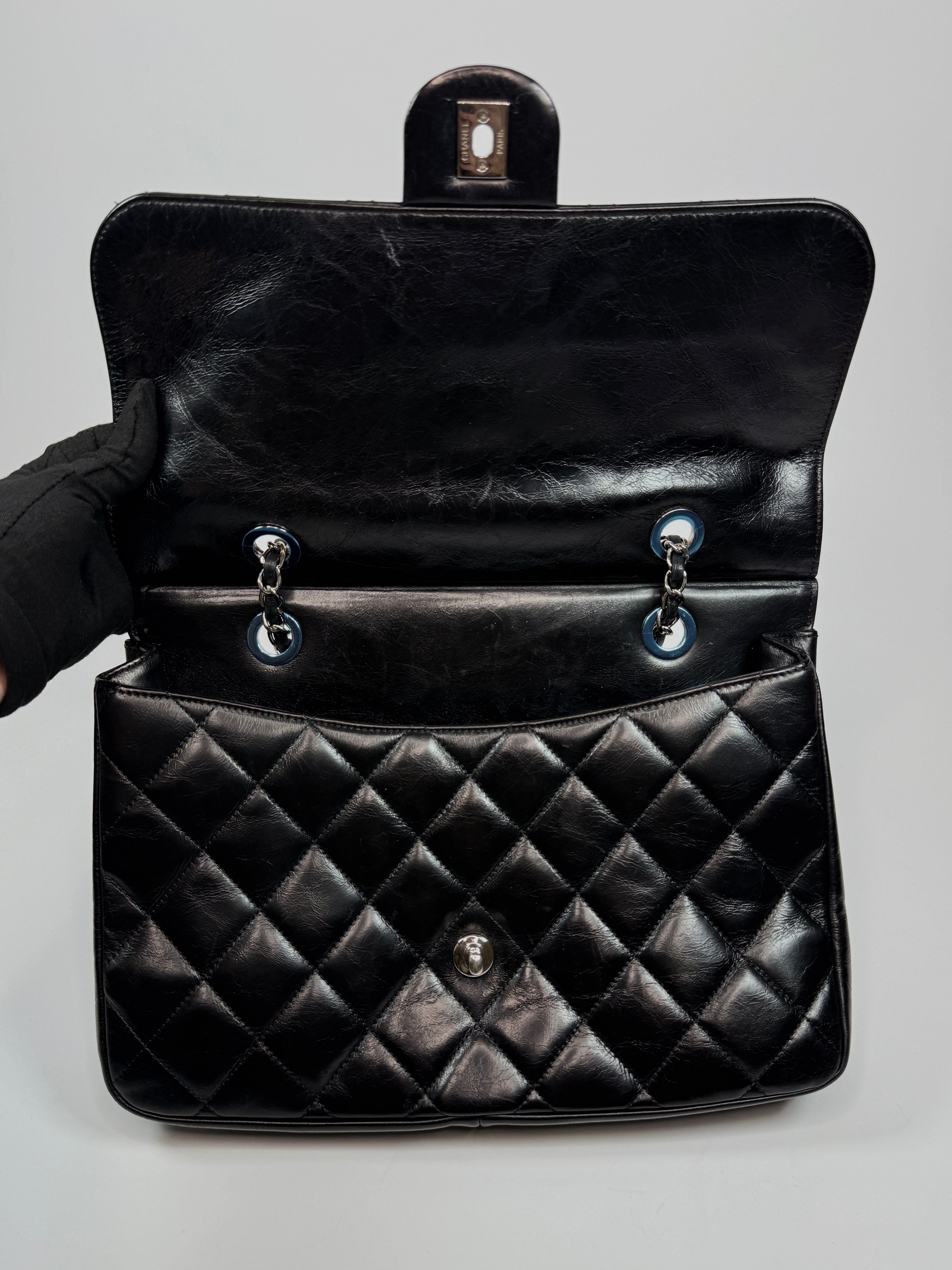 Chanel Delivery Top Handle Flap Bag In Black Calfskin Leather With Silver hardware in very good condition Authentic and preloved