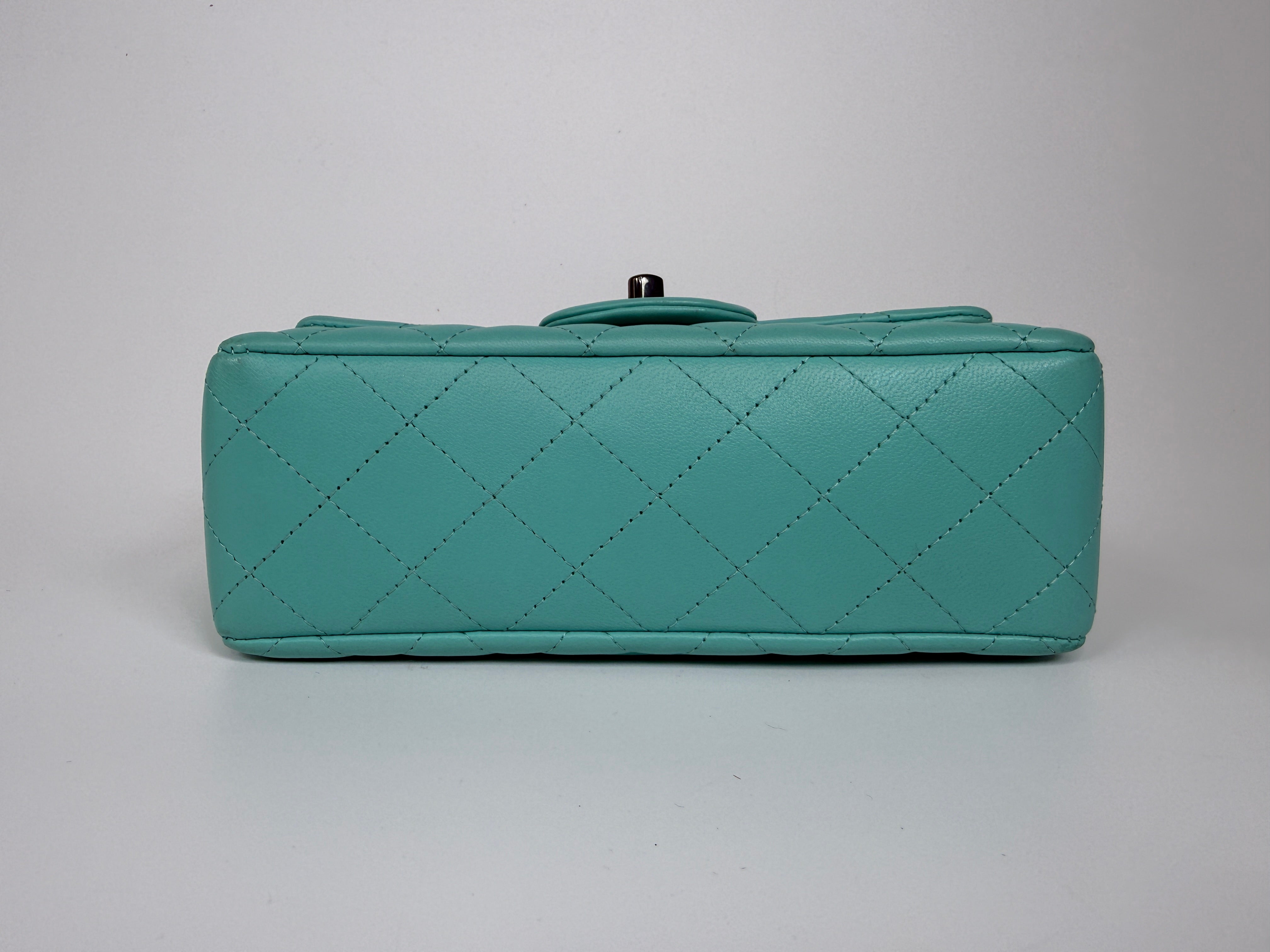 Authentic and preloved Chanel Mini Rectangle Flap Bag In Turquoise Lambskin Leather With Gunmetal Hardware In Excellent condition. Verified by Luxe Cheshire. 100% Authenticity Guarantee.
