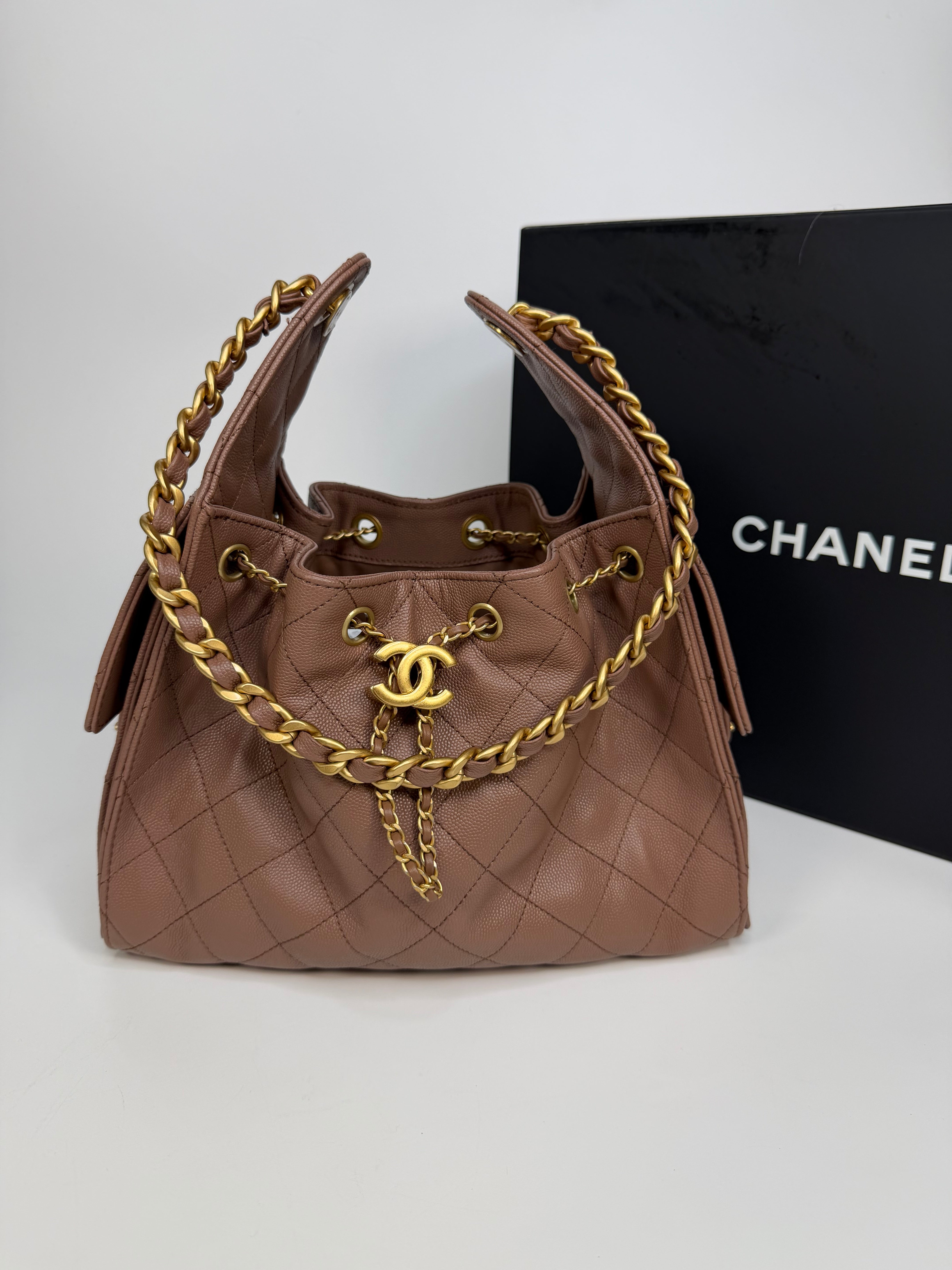 Chanel 25 Small In Brown Caviar Leather With Gold Hardware. Authentic and preloved in excellent condition