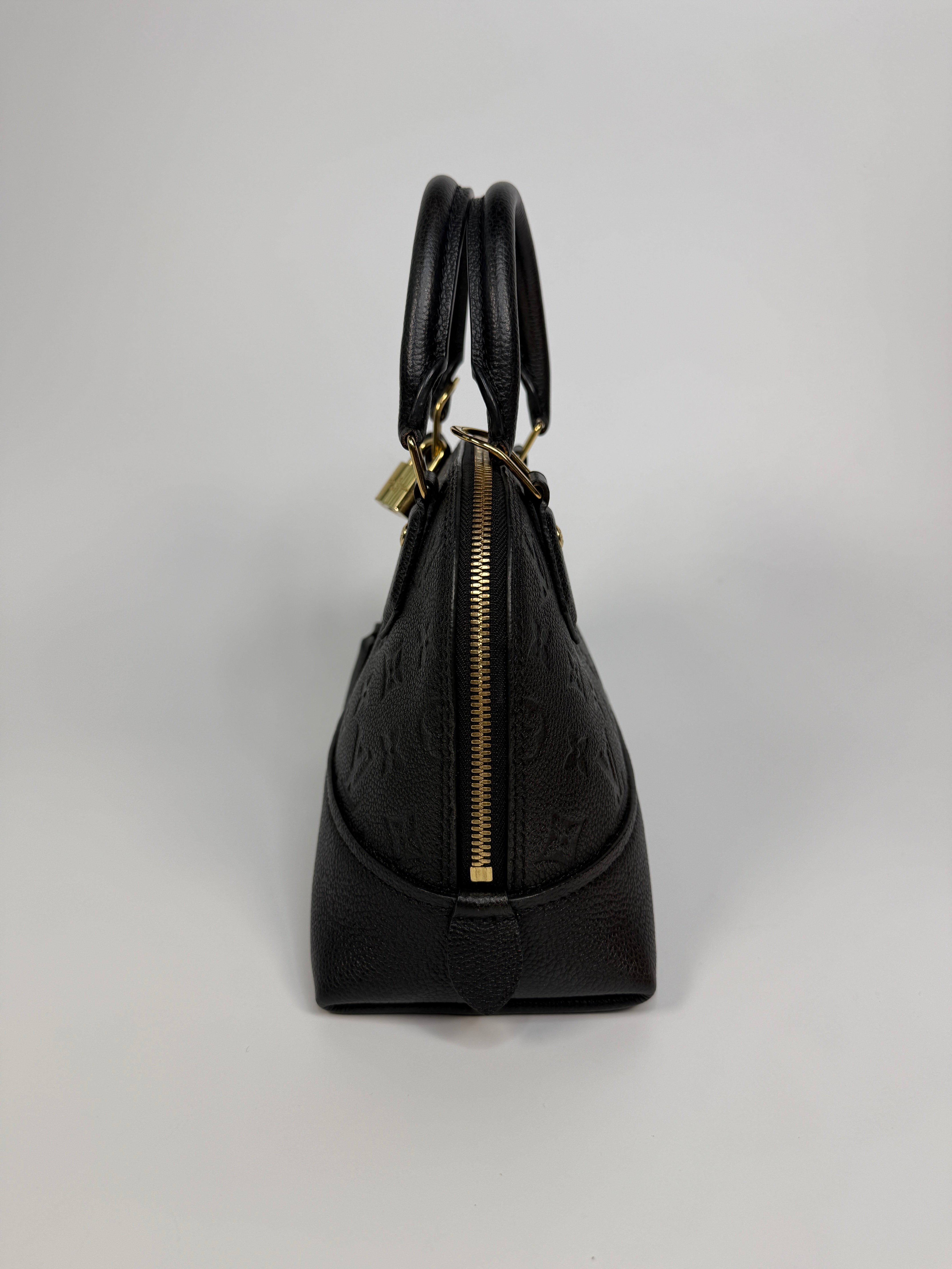 Authentic and preloved Louis Vuitton Alma BB In Empreinte Black Monogram With Gold Hardware