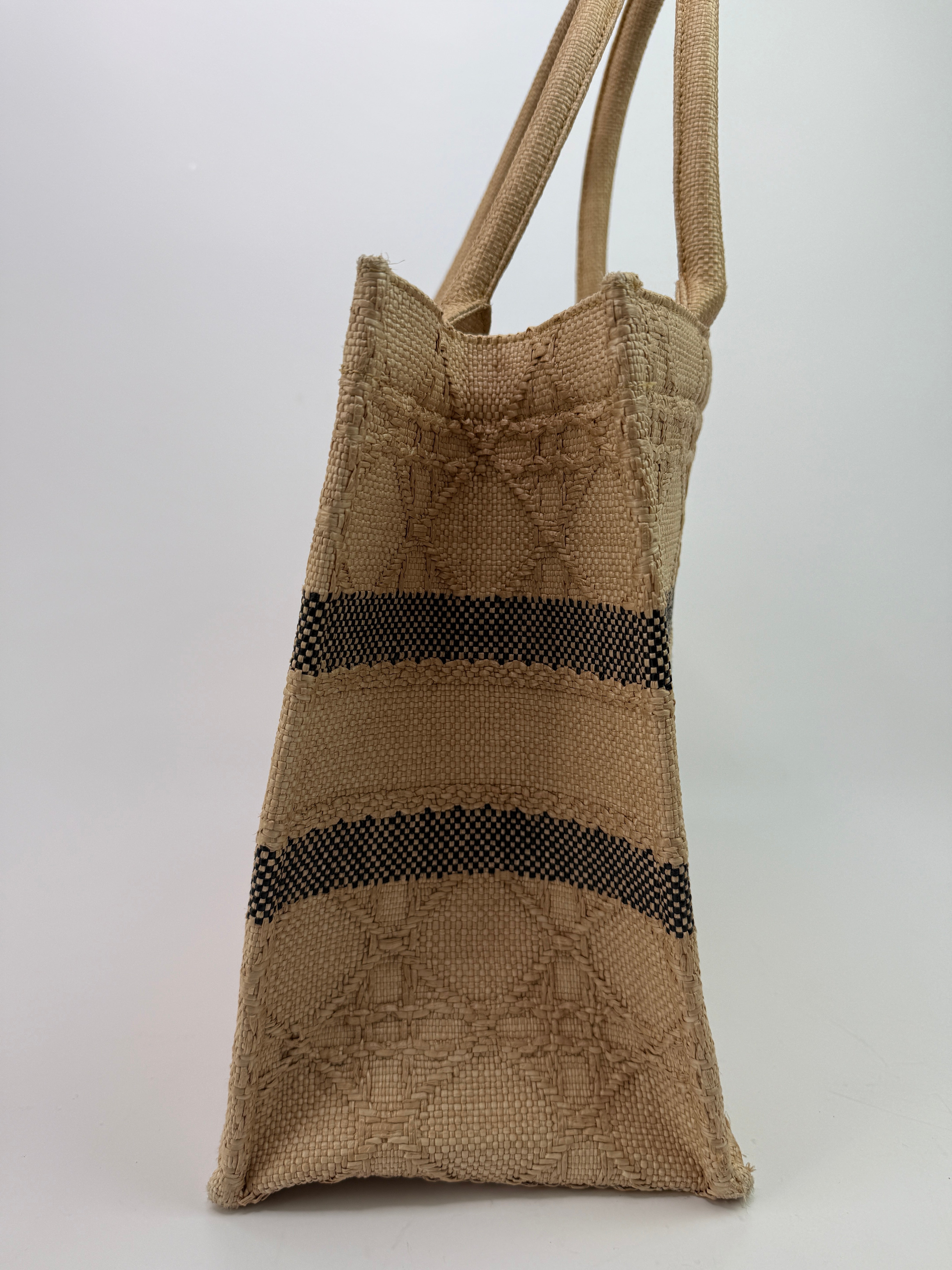 Authentic pre-loved Christian Dior Medium Raffia Cannage Book Tote.