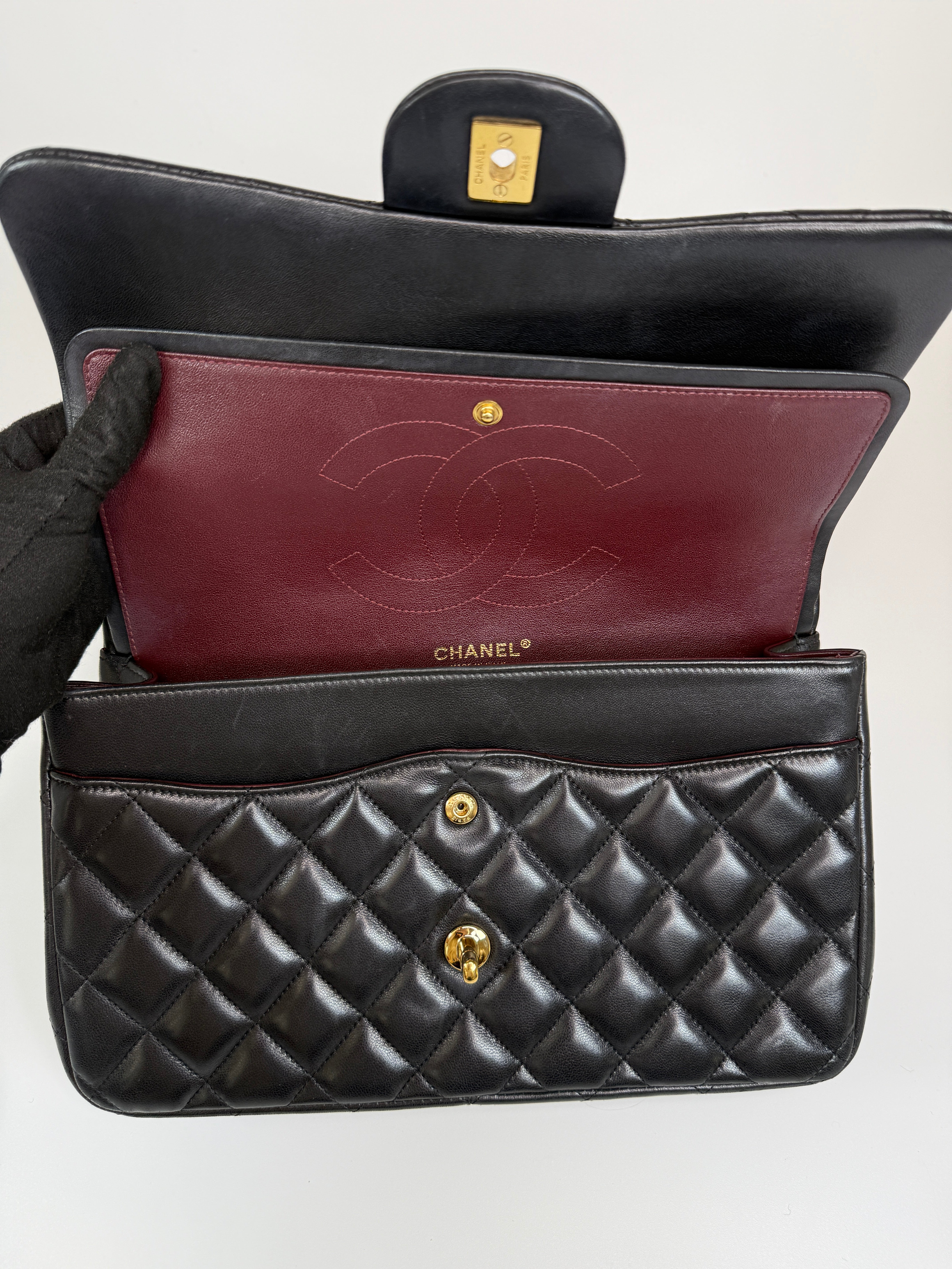 Authentic and preloved Chanel Jumbo Classic Flap Bag In Black Lambskin Leather With GOLD Hardware. Excellent condition. 100% Authenticity Guarantee