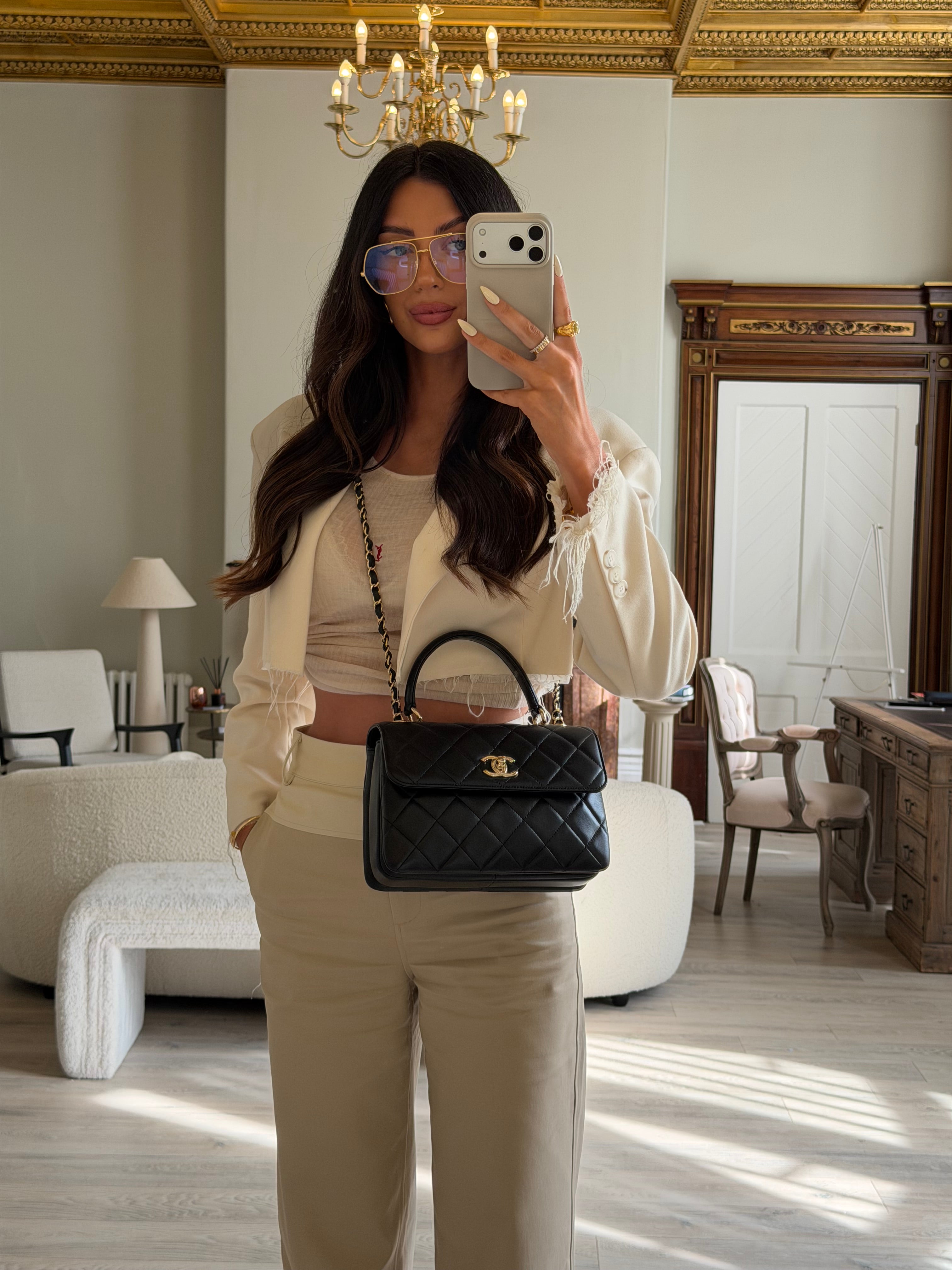 Authentic and preloved Chanel Trendy Top Handle Flap Bag In Black Lambskin With Gold Hardware. Excellent condition. 100% Authenticity guarantee