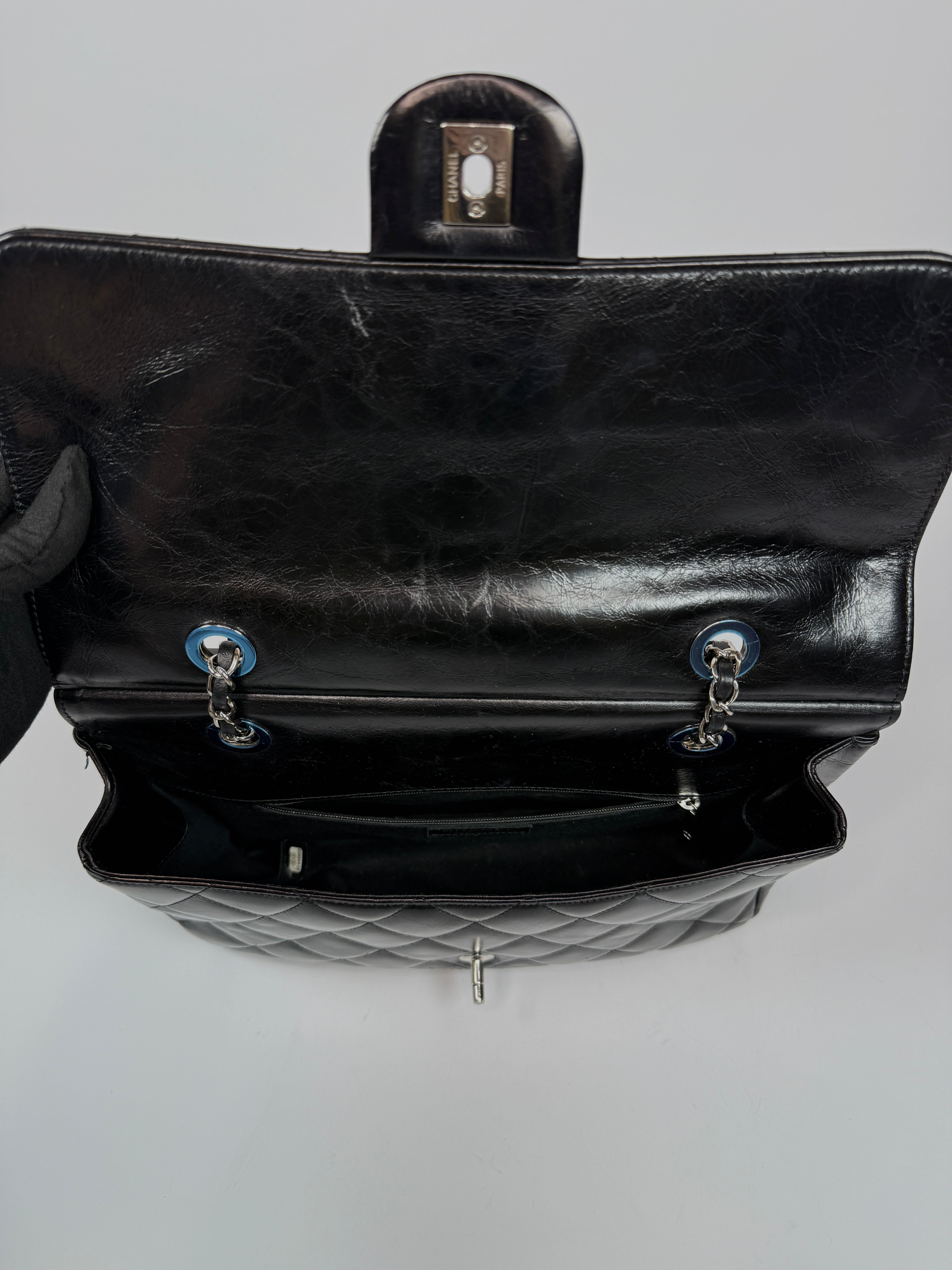 Chanel Delivery Top Handle Flap Bag In Black Calfskin Leather With Silver hardware in very good condition Authentic and preloved