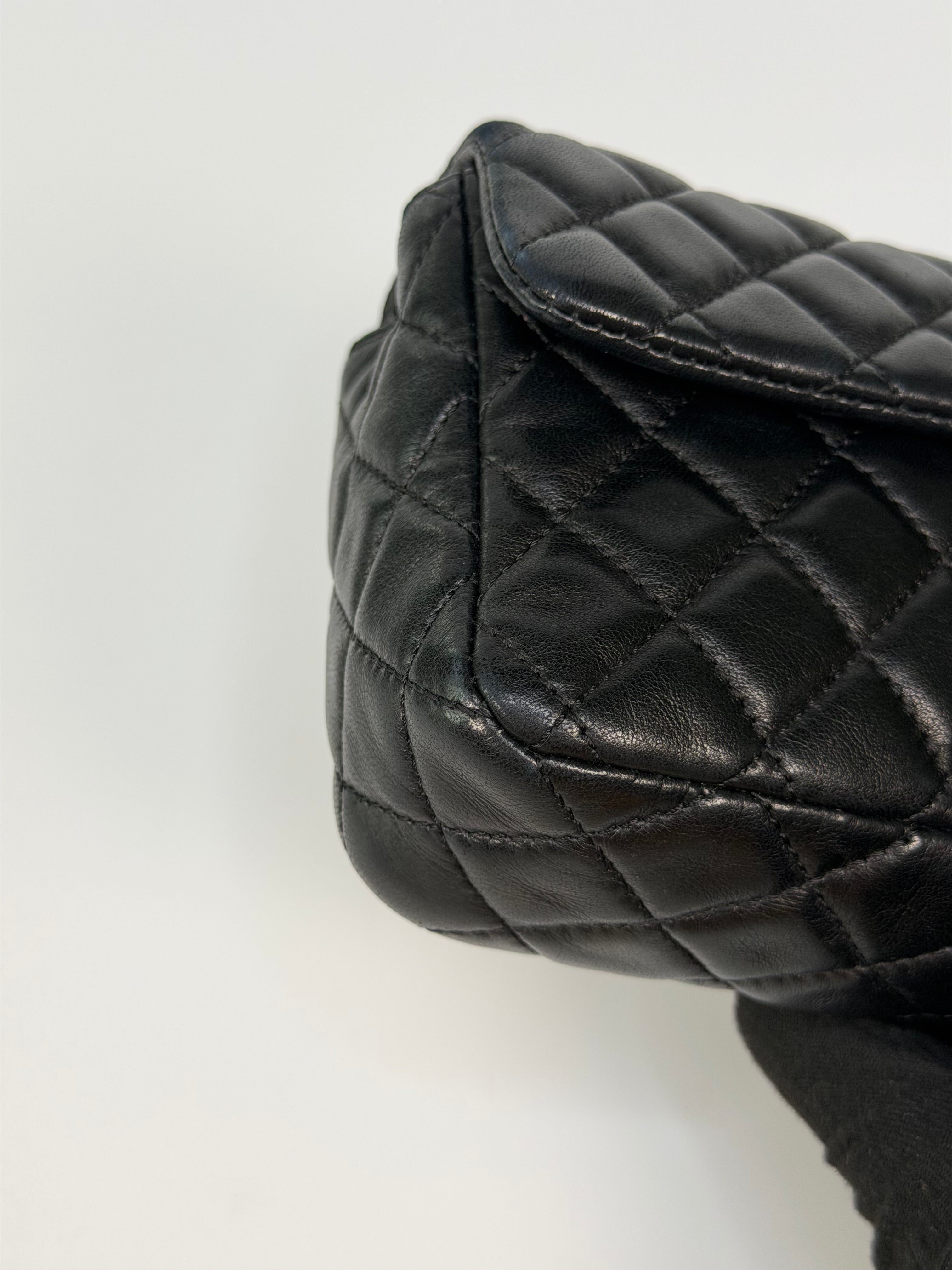 Chanel East West Charms Bag In Black Lambskin Leather With Gold Hardware. Authentic and preloved in excellent condition. 100% guarantee