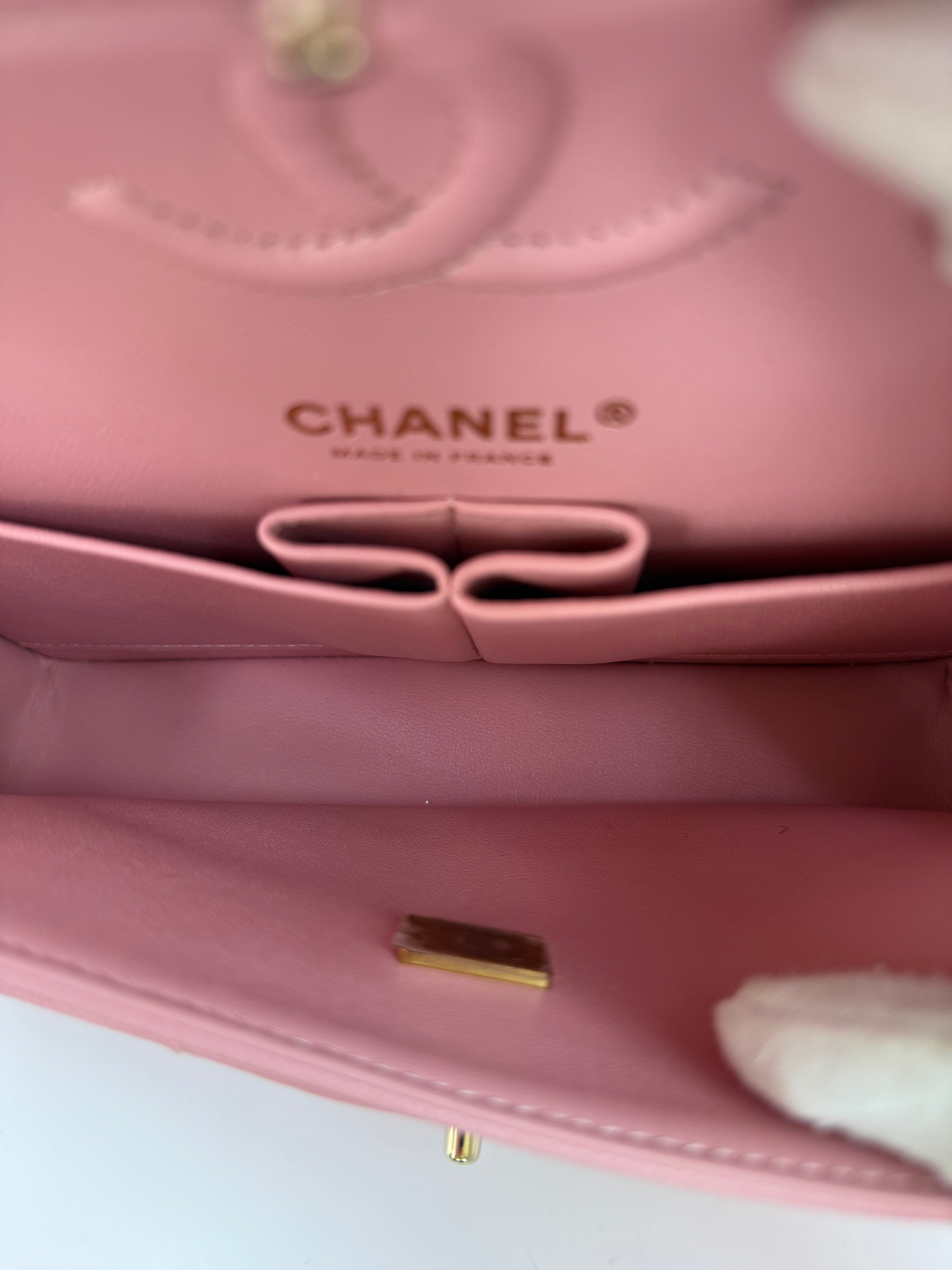 Authentic pre-loved Chanel Small Classic Double Flap In Pink Caviar Leather With Gold Hardware.