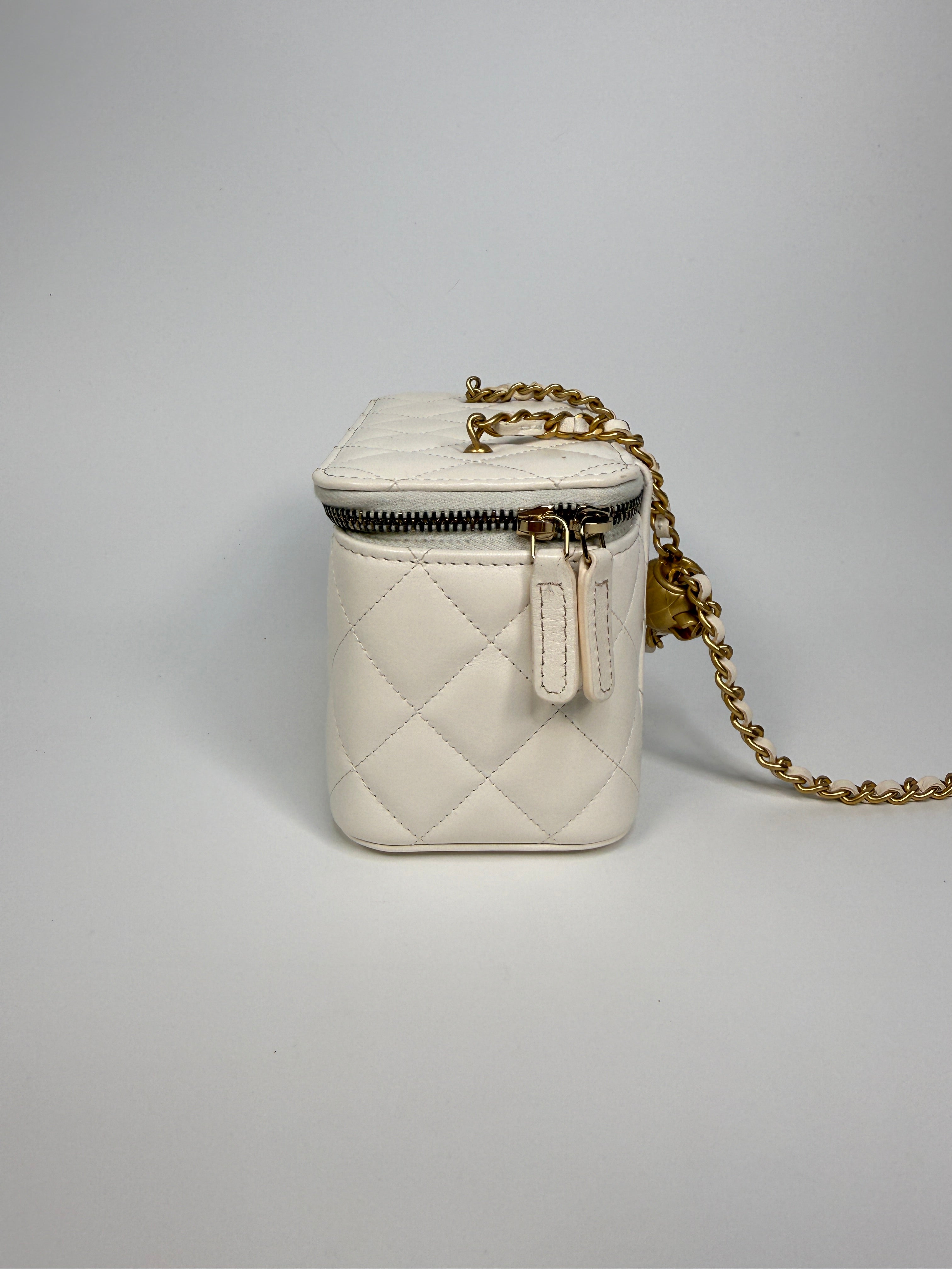 Authentic and preloved Chanel Quilted Pearl Crush Mini Vanity In White Lambskin Leather With Aged Gold Hardware