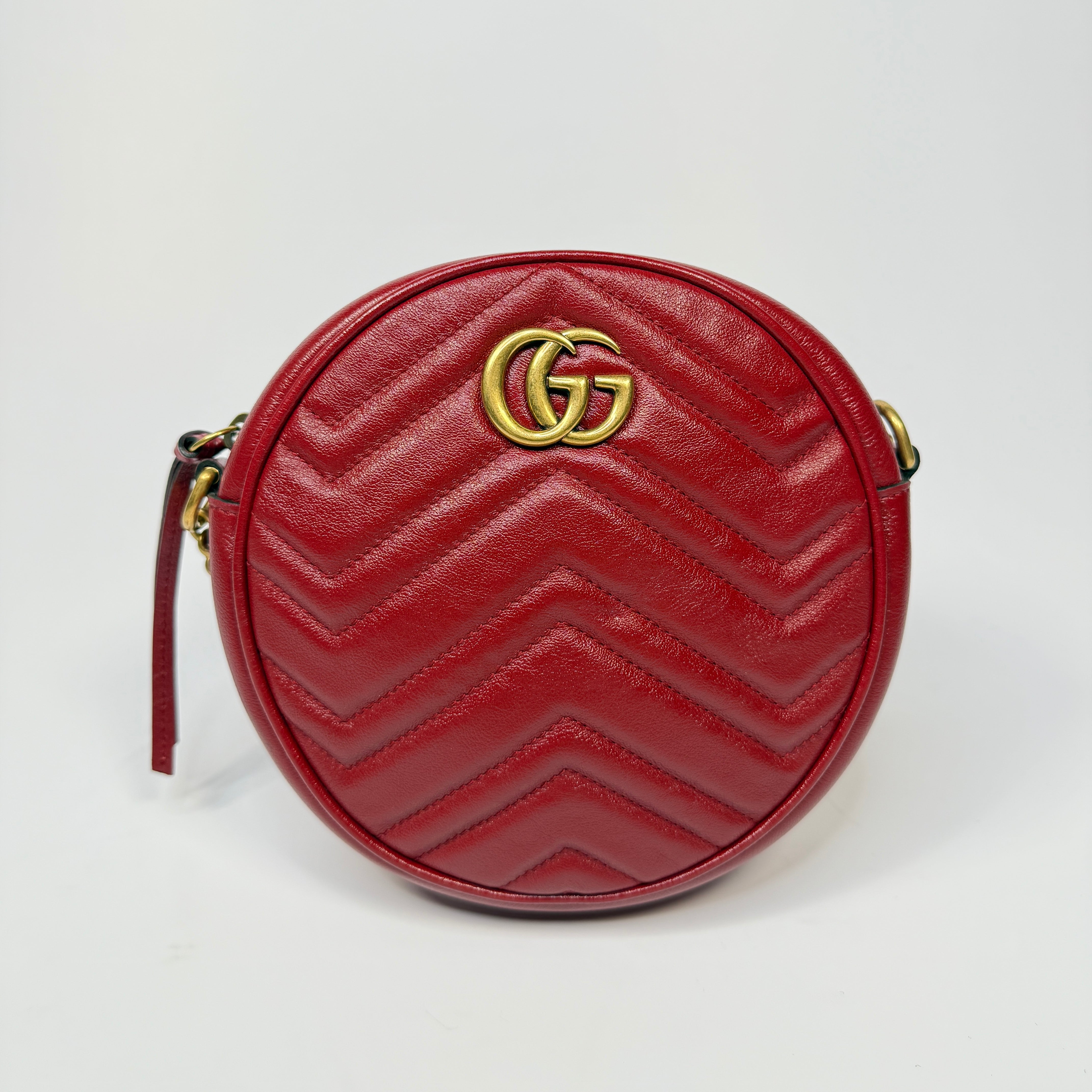 Gucci GG Marmont Round Shoulder Bag In Red Leather, very good condition. Authentic and preloved. 100% Authenticity guarantee