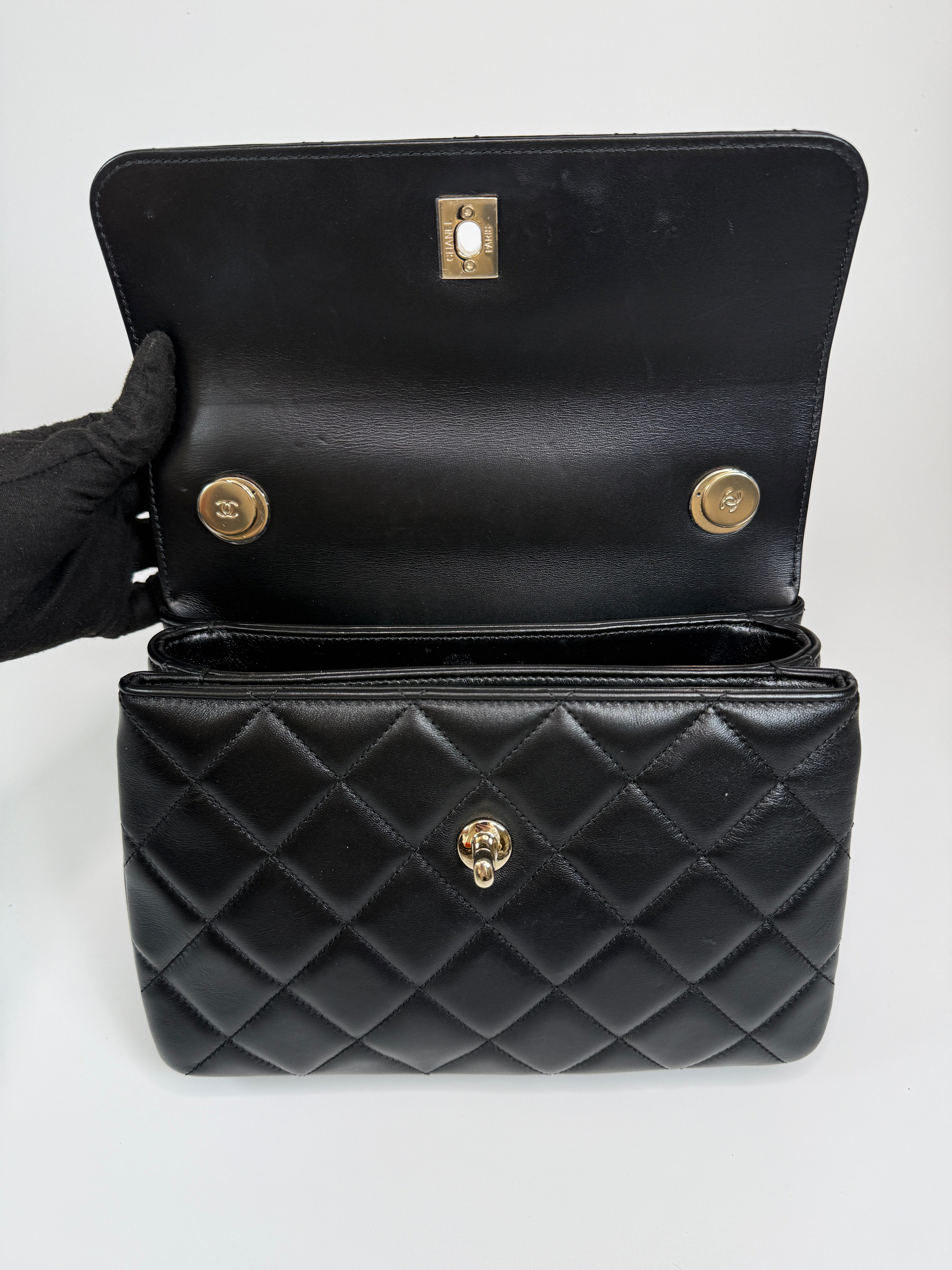 Authentic and preloved Chanel Trendy Top Handle Flap Bag In Black Lambskin With Gold Hardware. Excellent condition. 100% Authenticity guarantee