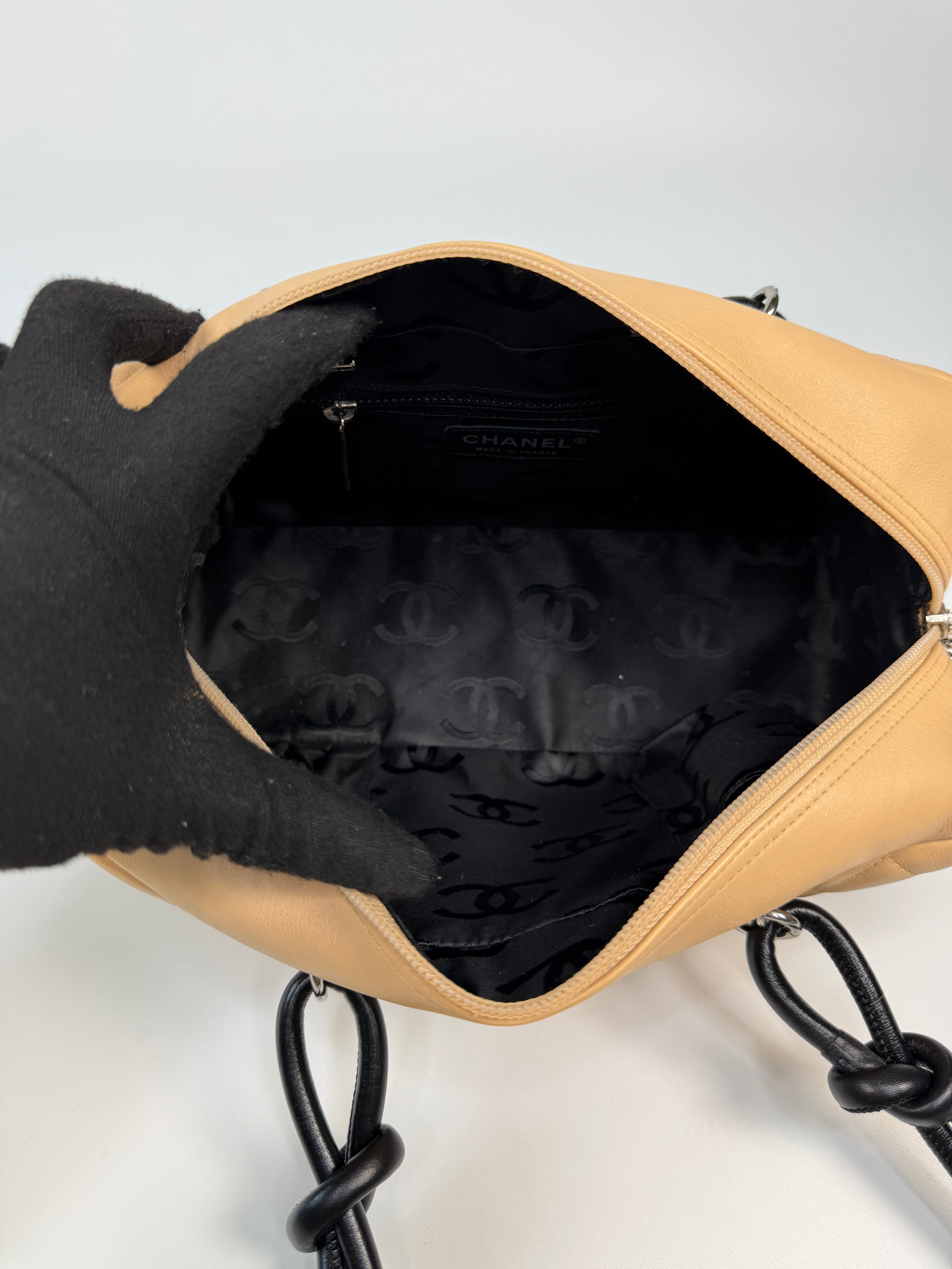 Chanel Cambon Bowling Bag In Beige / Black Leather With Silver Hardware. Authentic and preloved in excellent condition.