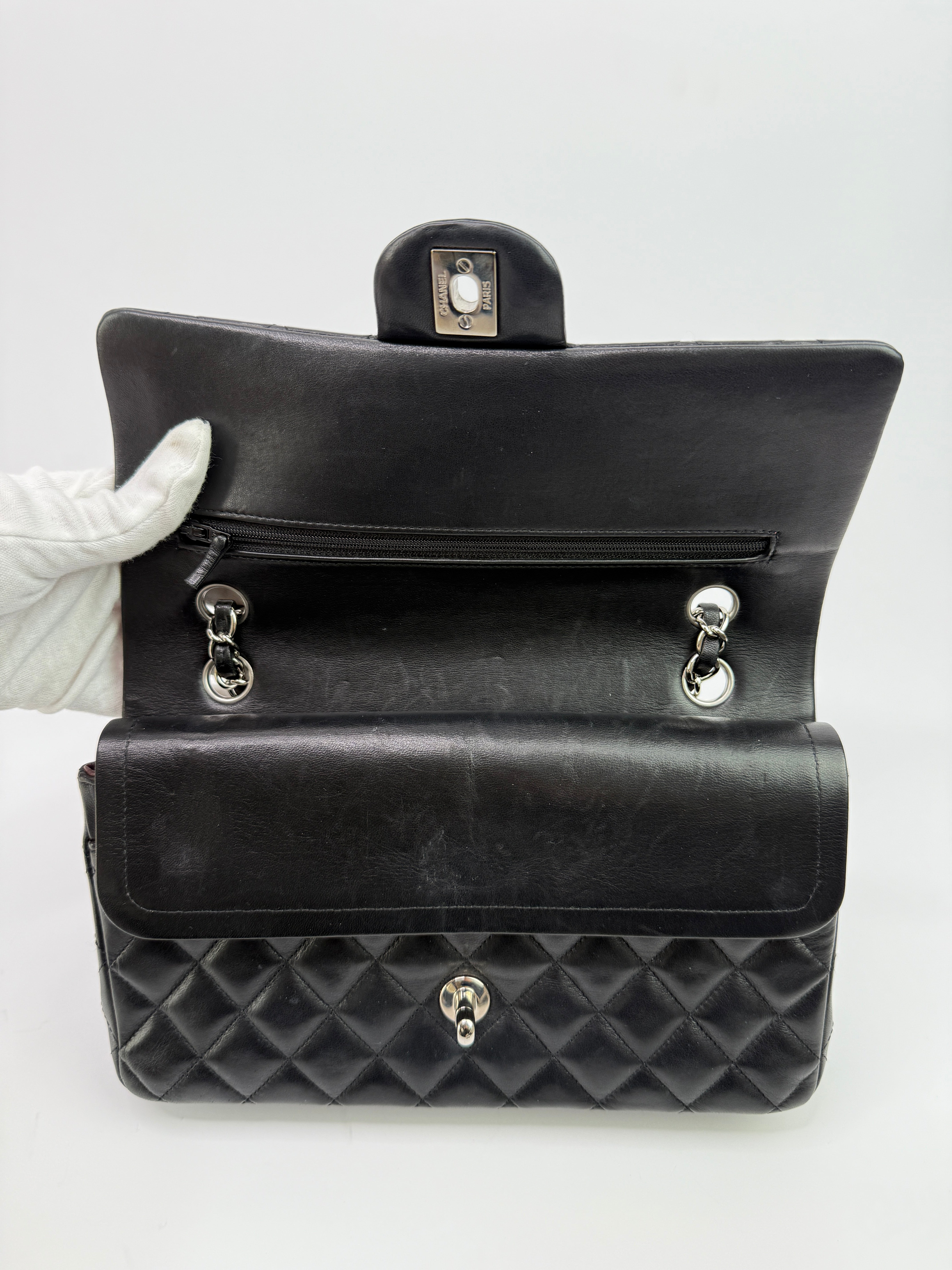Authentic and preloved Chanel Medium Classic Double Flap Black Lambskin With Silver hardware Excellent condition. 100% Authenticity guarantee
