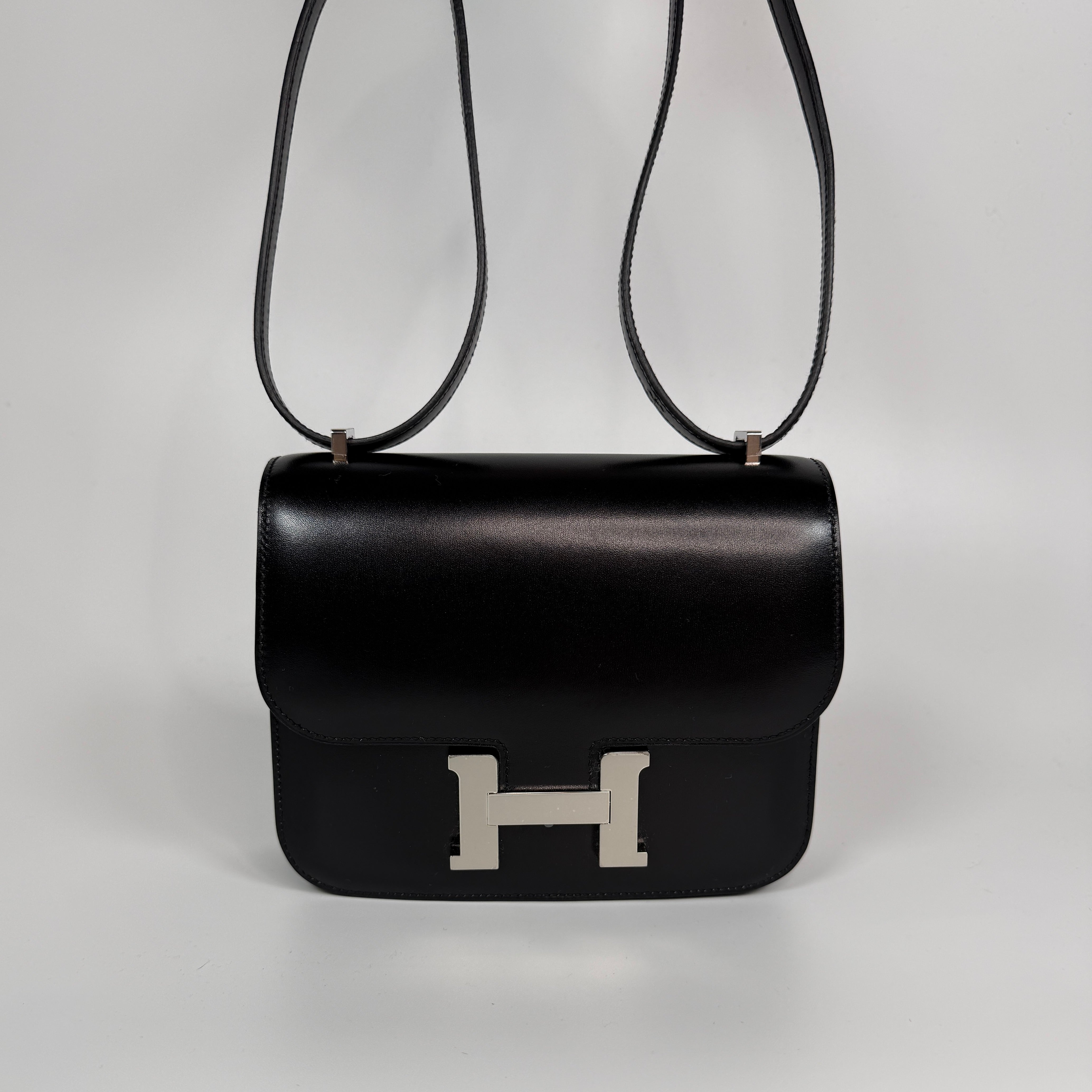 Authentic and preloved Hermès Constance 18 In Black Box Leather With Palladium Hardware. 100% Authenticity guarantee.
