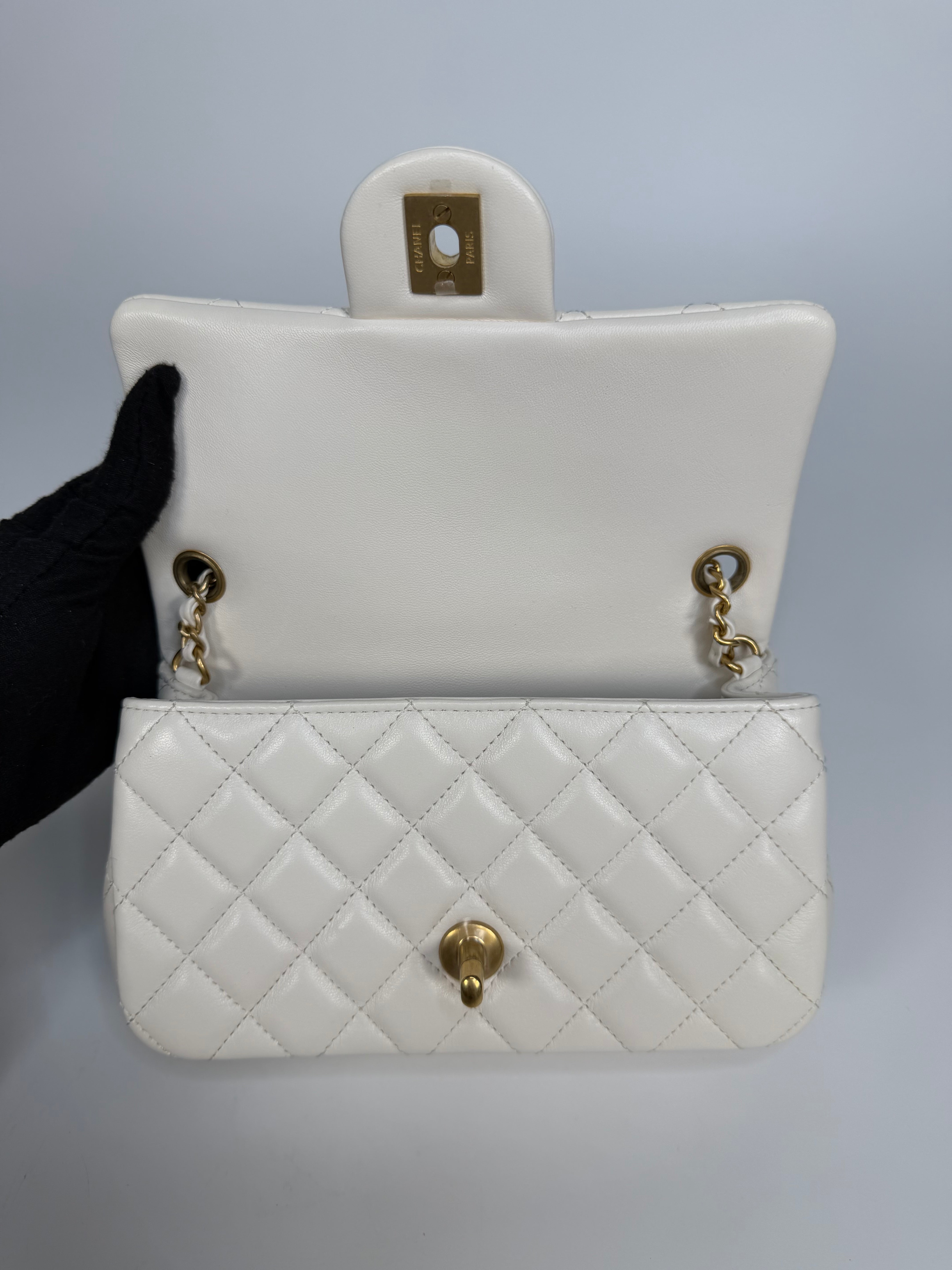 Chanel Pearl Crush Mini Rectangle In White Lambskin Leather Gold Hardware. Authentic and preloved in excellent condition with 100% authenticity guarantee.