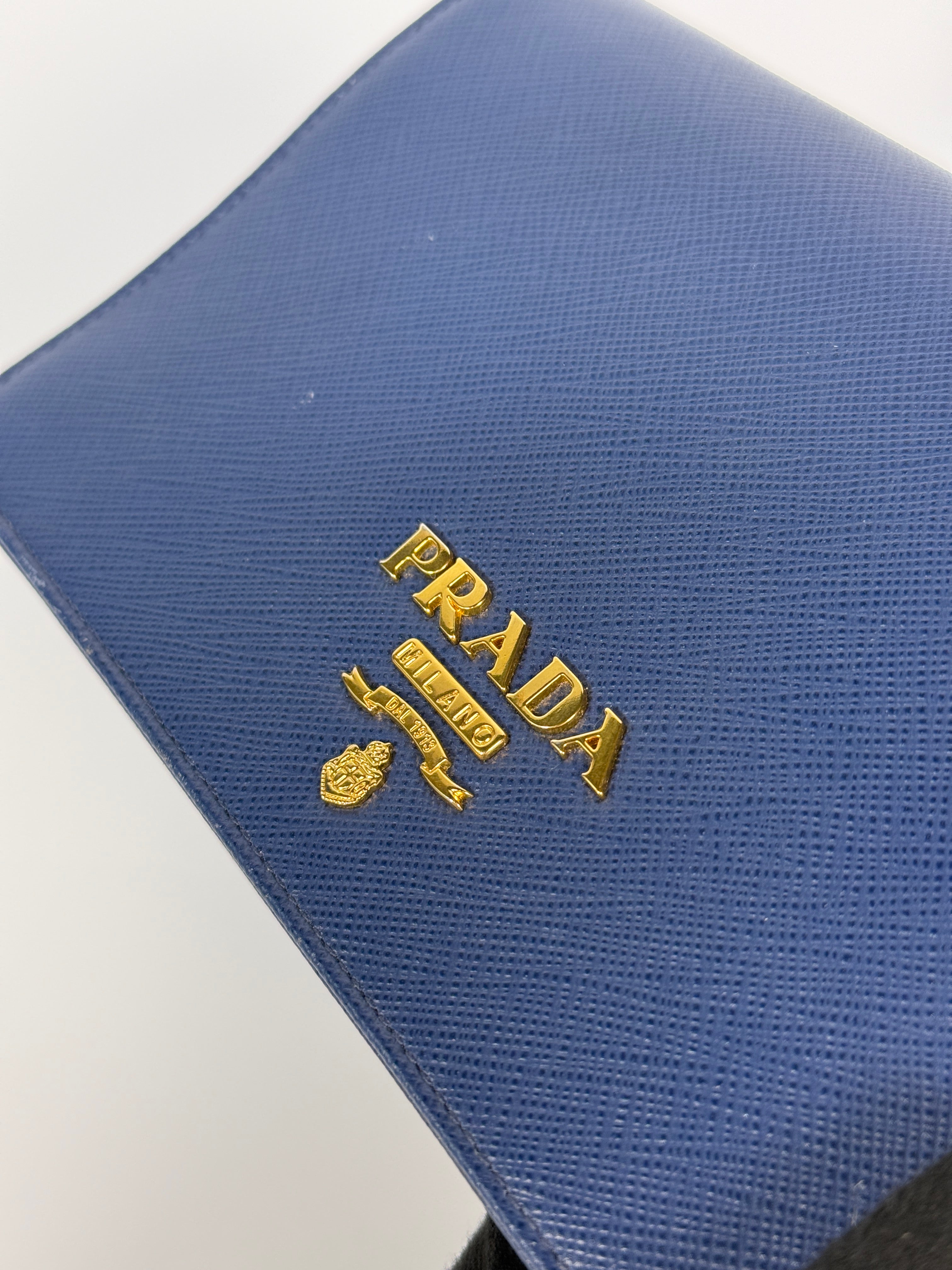 Authentic and preloved Prada Wallet Chain Bag In Blue Saffiano Leather With Gold Hardware. Very Good condition. 100% Authenticity guarantee