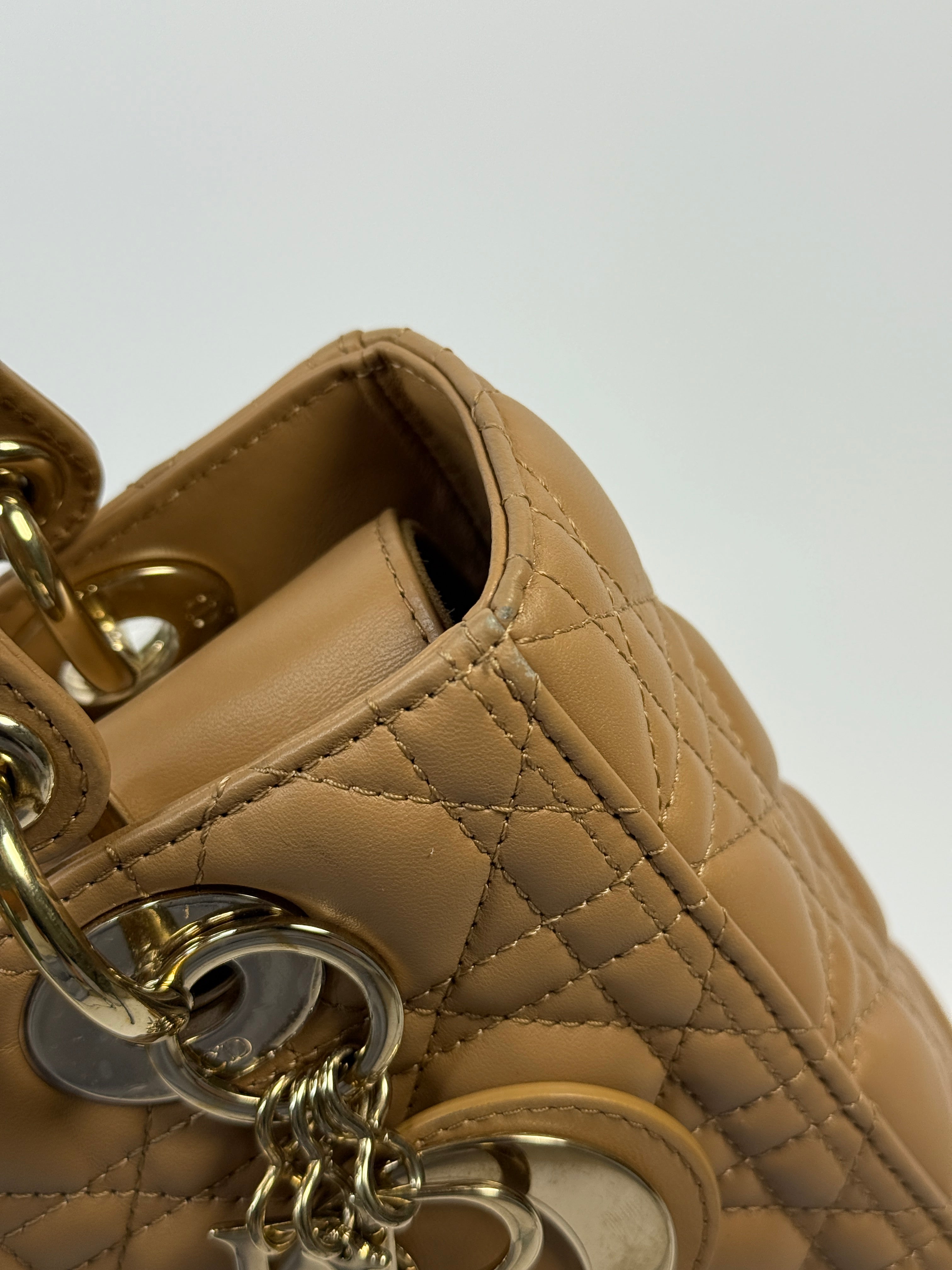 Authentic pre-loved Christian Dior Medium Lady Dior Bag in gold with gold hardware