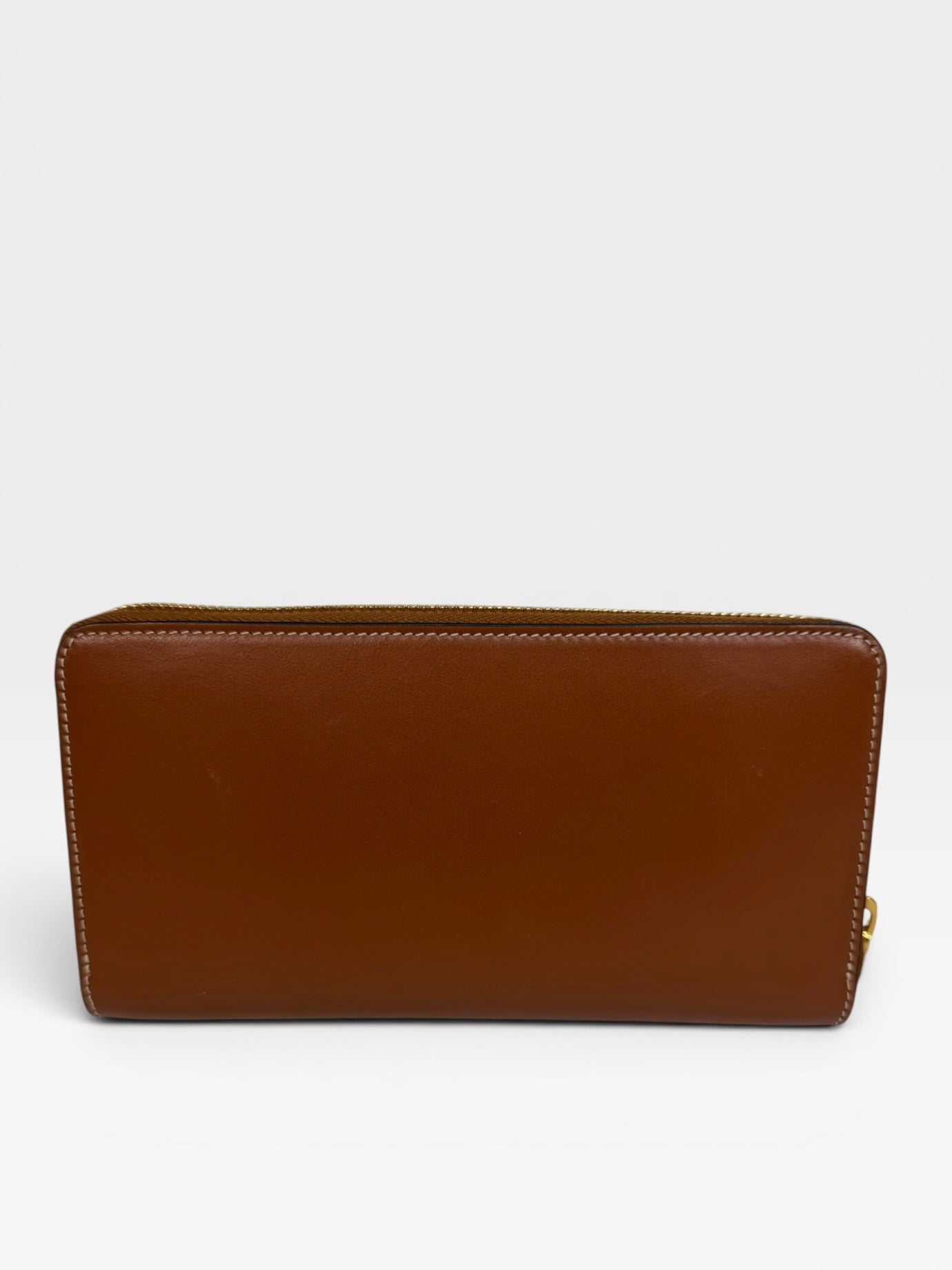 Celine Triomphe Long Wallet In Tan Calfskin With Gold Hardware. Authentic and preloved in excellent condition