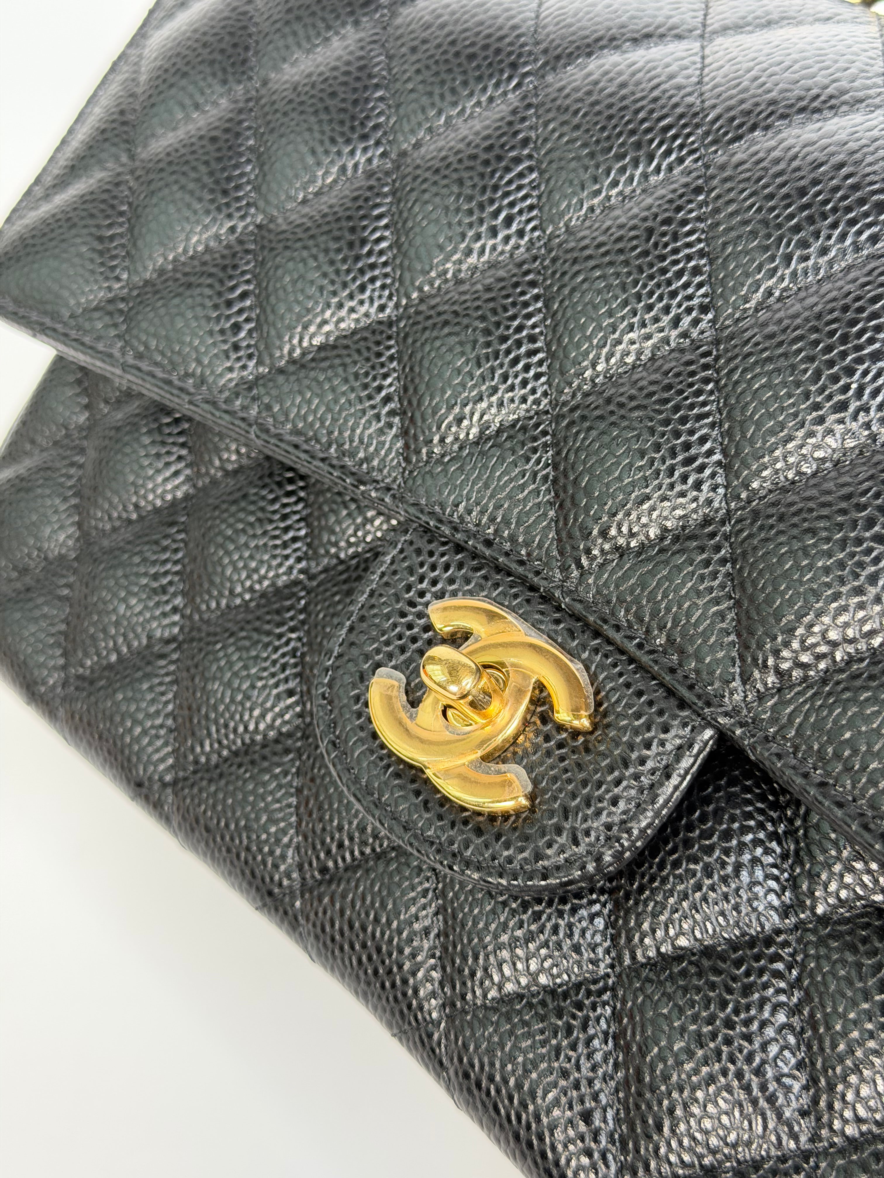 Chanel Medium Classic Double Flap In Black Caviar With Gold Hardware. Authentic and preloved in new and unused condition.