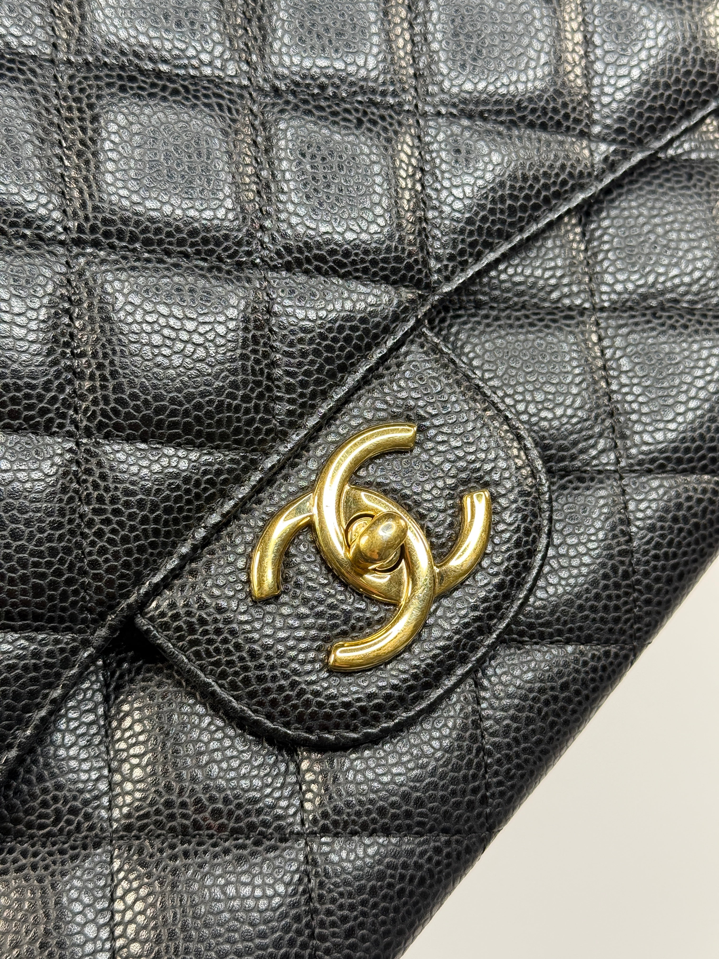 Chanel Maxi Classic Double Flap In Black Caviar Leather With Gold Hardware
Pre Loved & Authentic