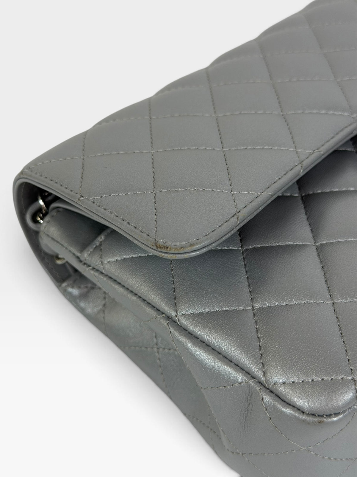 Chanel Medium Classic Double Flap In Silver Lambskin Leather Silver Hardware. 100% authentic and preloved in excellent condition