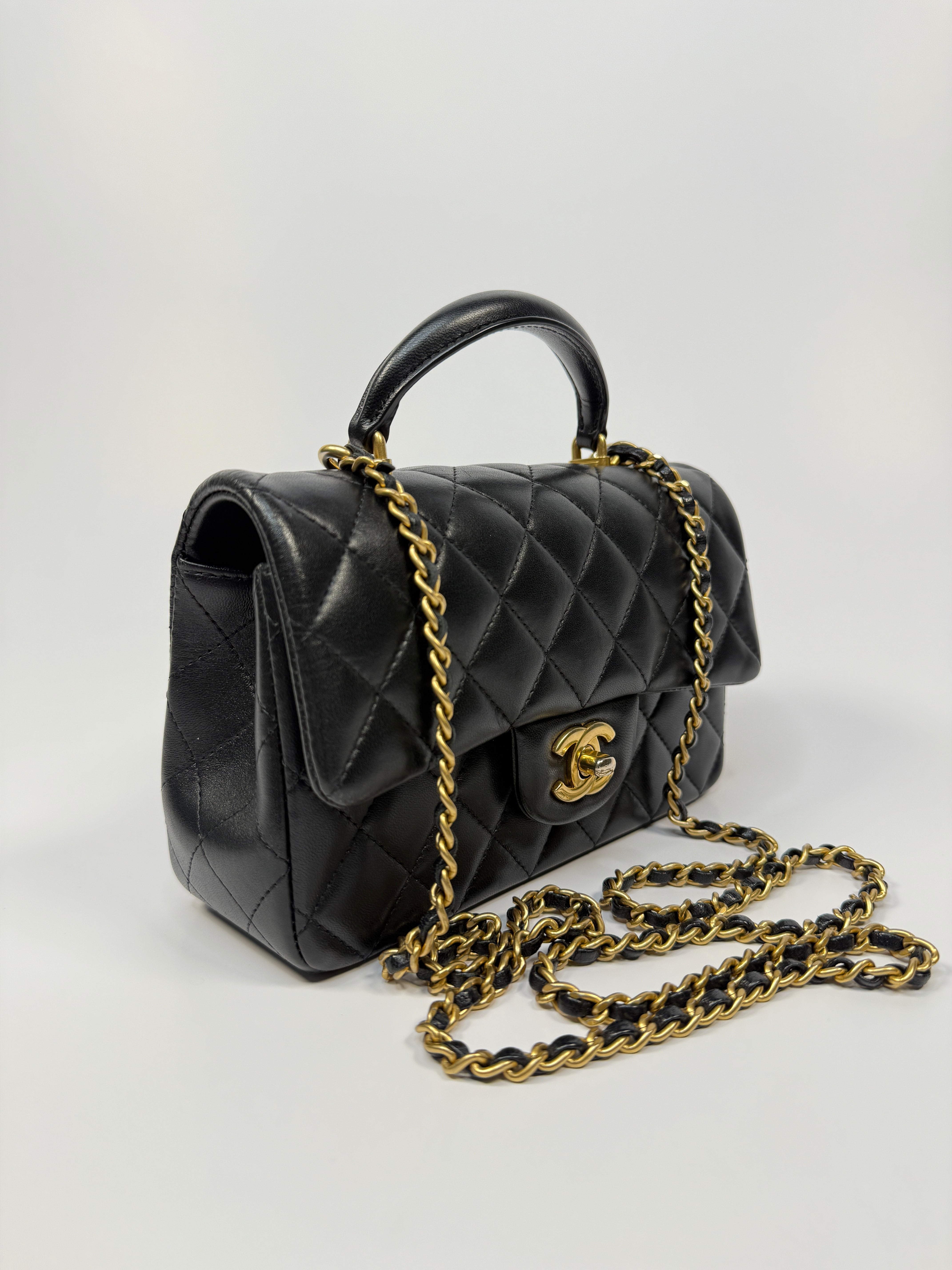 Chanel Mini Rectangle Top Handle Flap Bag In Black Lambskin With Gold Hardware
Pre Loved & Authentic