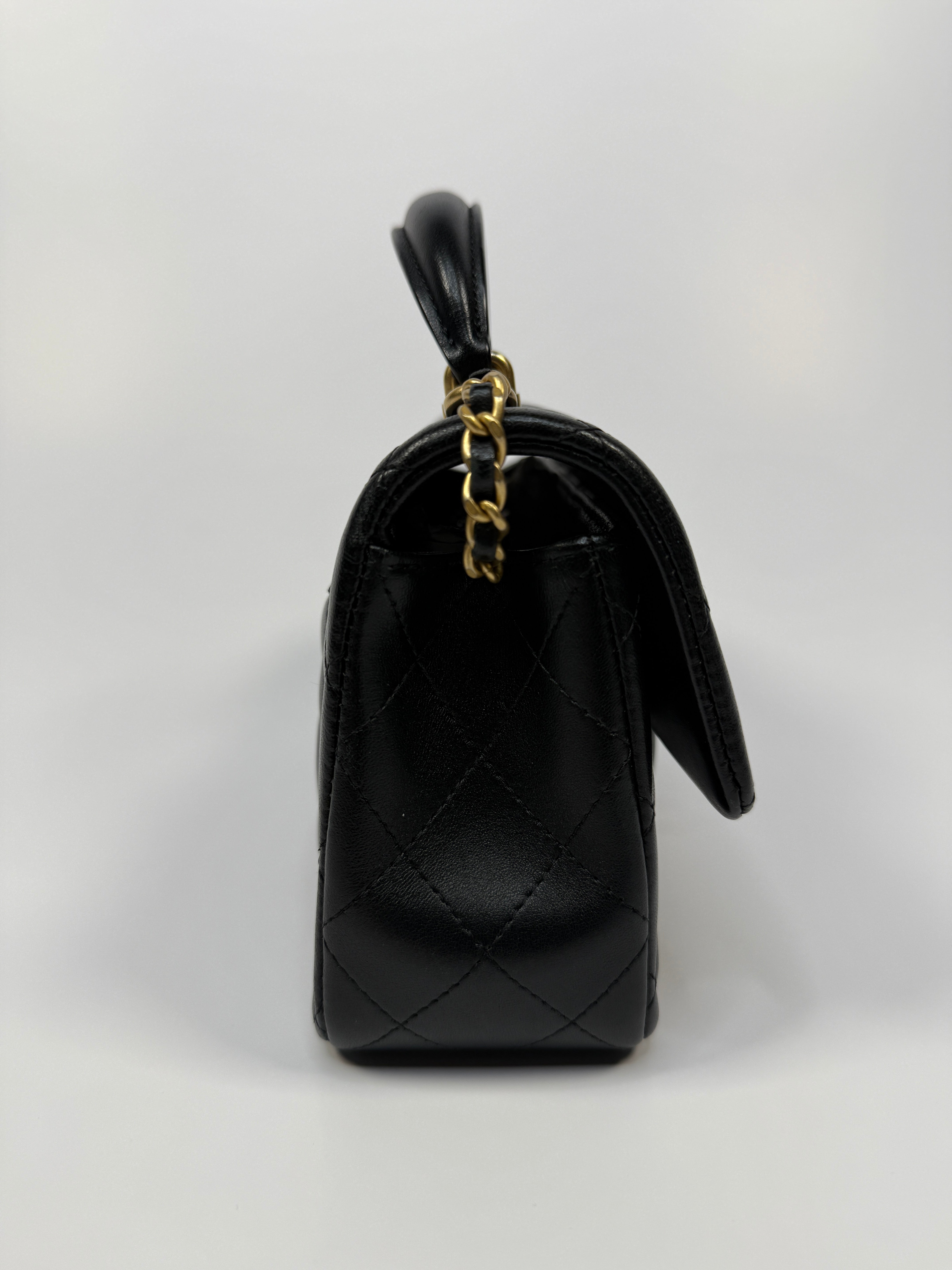 Chanel Mini Rectangle Top Handle Flap Bag In Black Lambskin With Gold Hardware
Pre Loved & Authentic