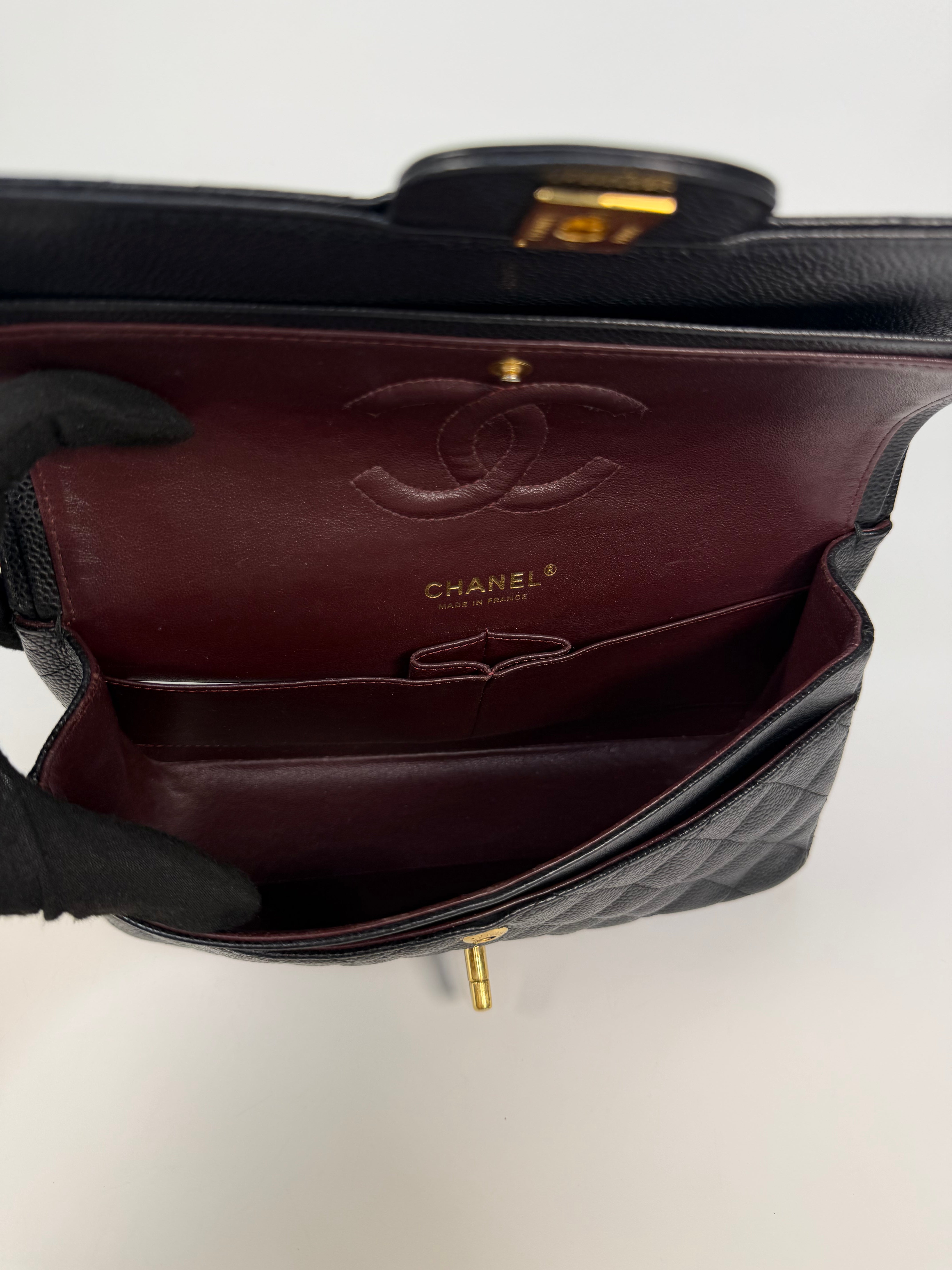 Chanel Medium Classic Double Flap In Black Caviar Leather Gold Hardware. 100% authentic and preloved in excellent condition
