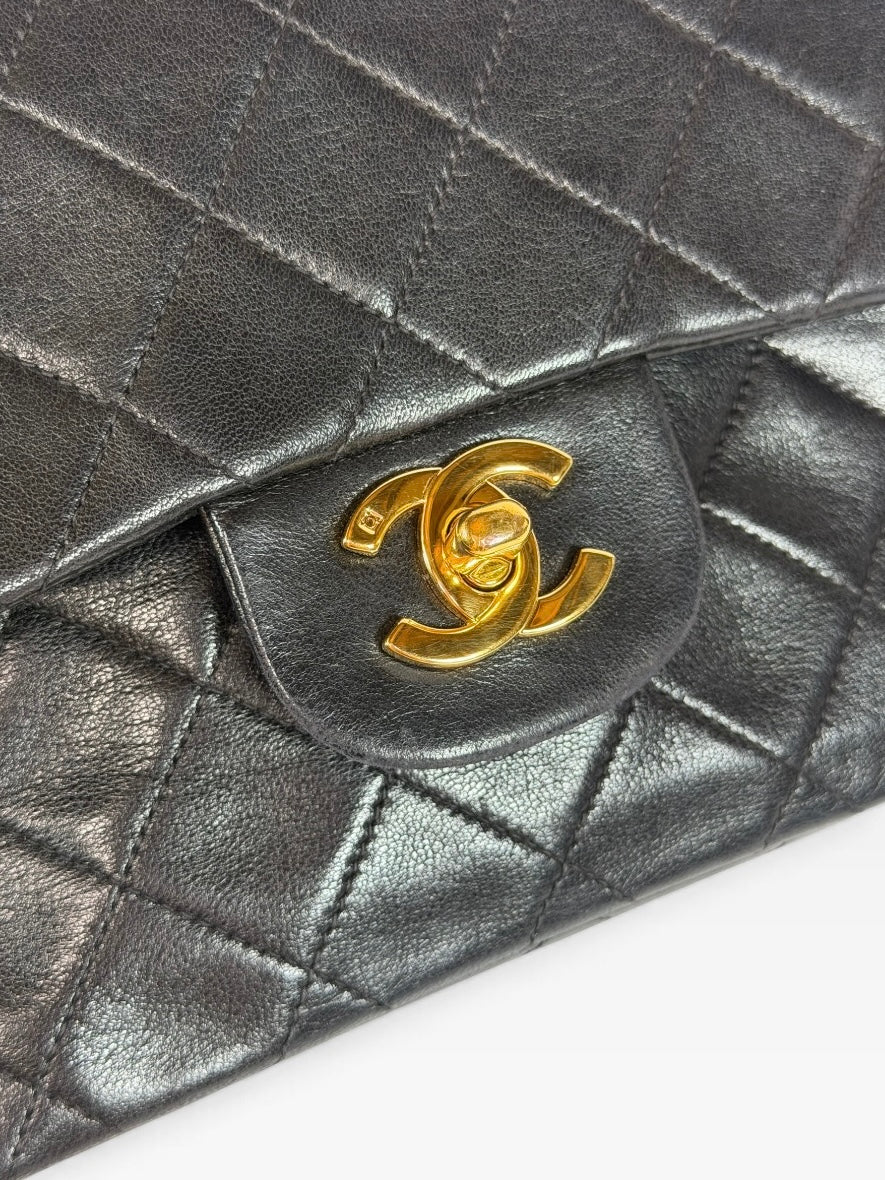Chanel Vintage Small Classic Double Flap In Black Lambskin Leather 24Kt Hardware. Authentic and preloved in excellent condition. 100% guarantee