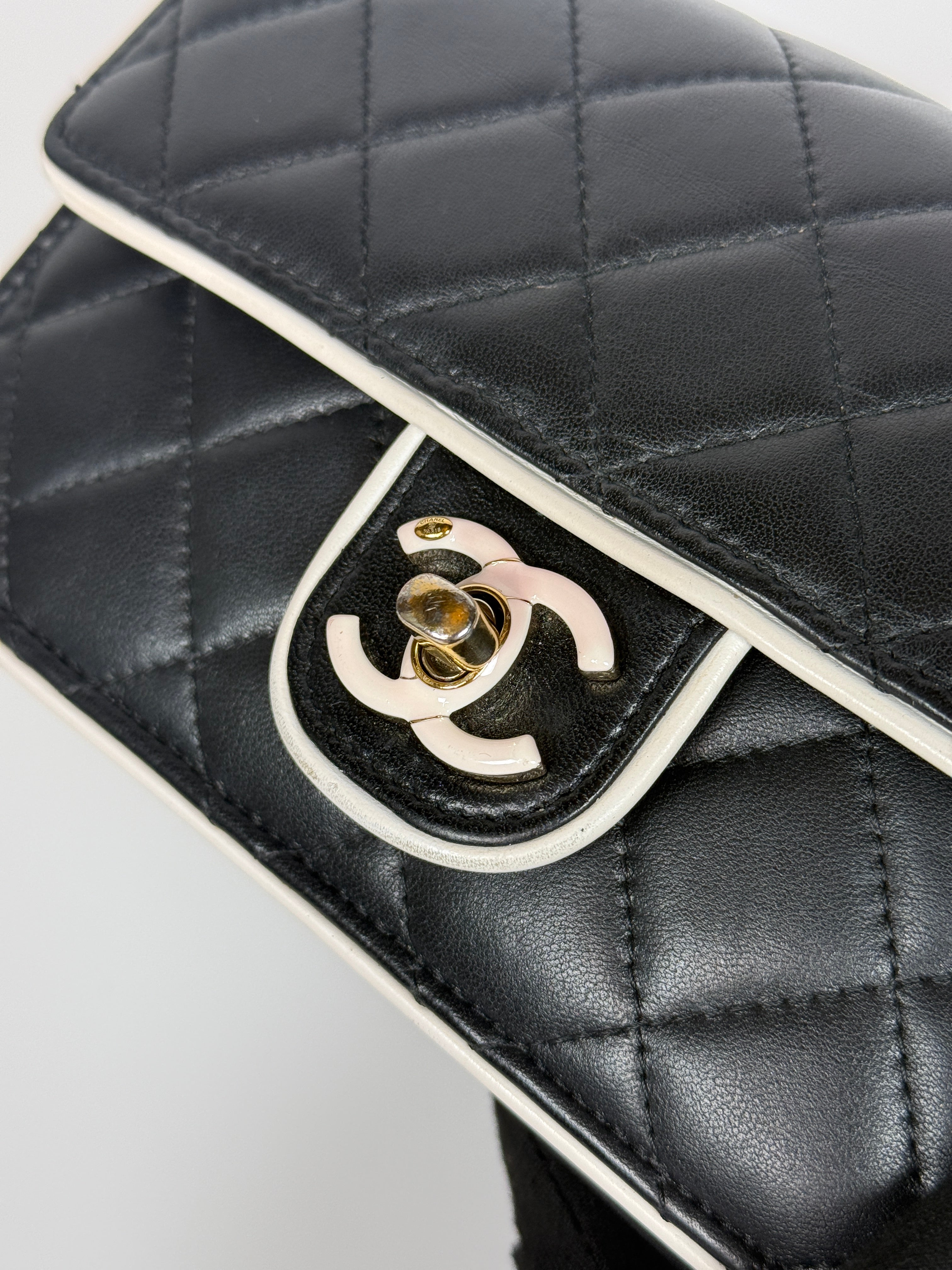 Authentic and preloved Chanel Wallet On Chain In Black & White Lambskin Leather With Pale Gold Hardware. Very Good Condition. 100% Authenticity Guarantee