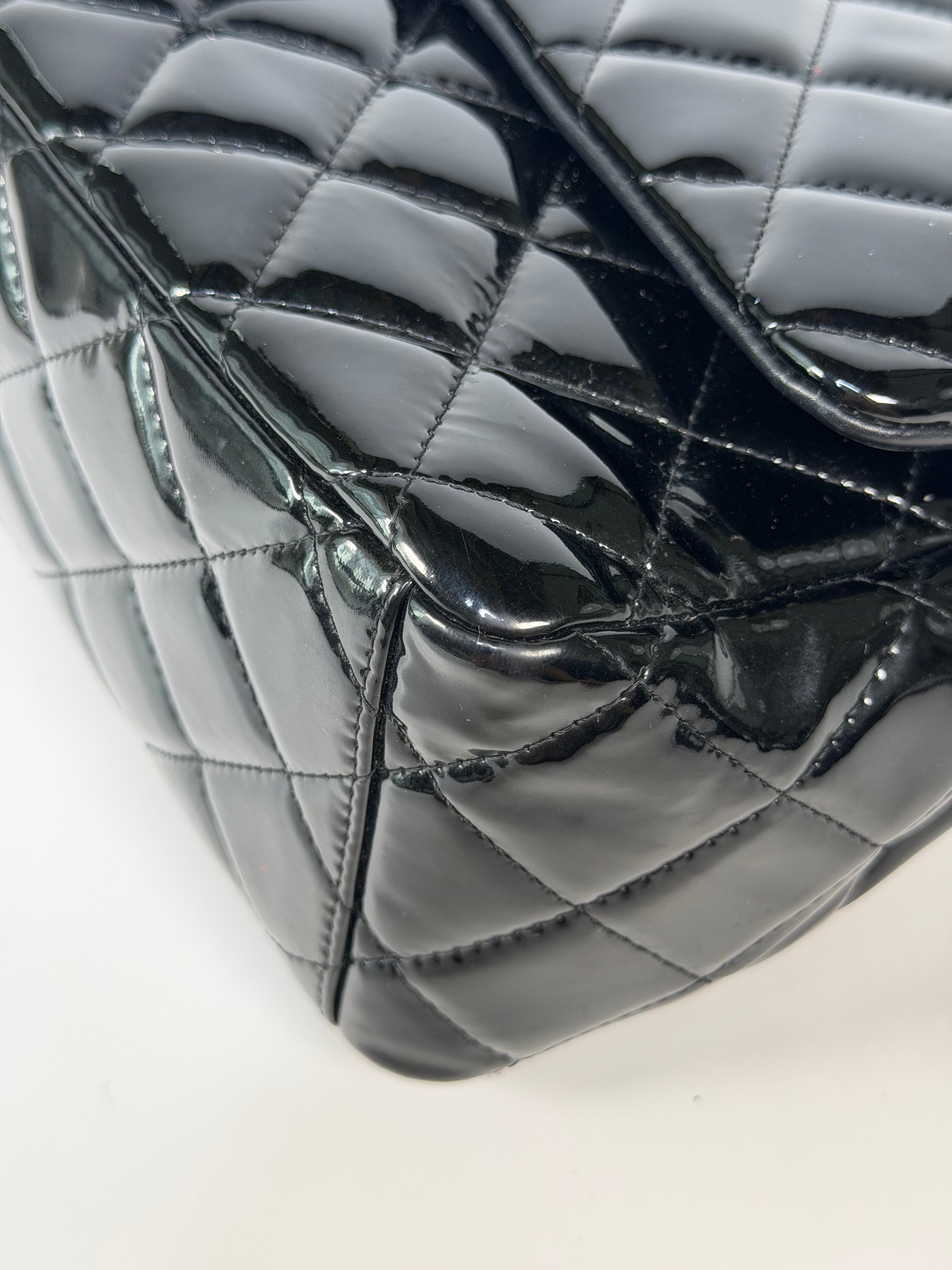 Chanel Maxi Classic Double Flap In Black Patent Leather With Silver Hardware. 100% authentic and preloved in excellent condition.
