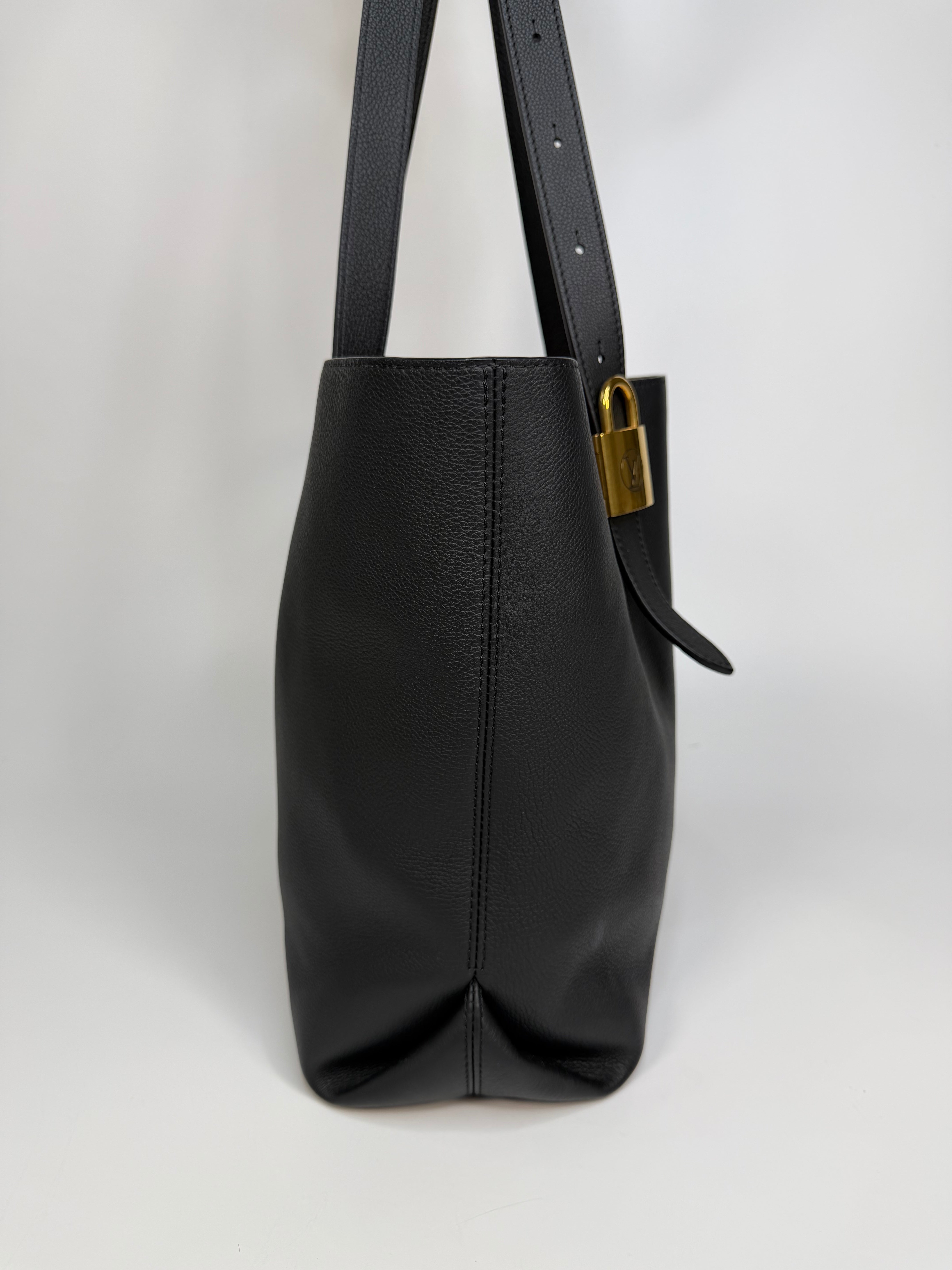 Louis Vuitton Low Key Cabas MM In Black Calfskin With Gold Hardware. Authentic and preloved in excellent condition