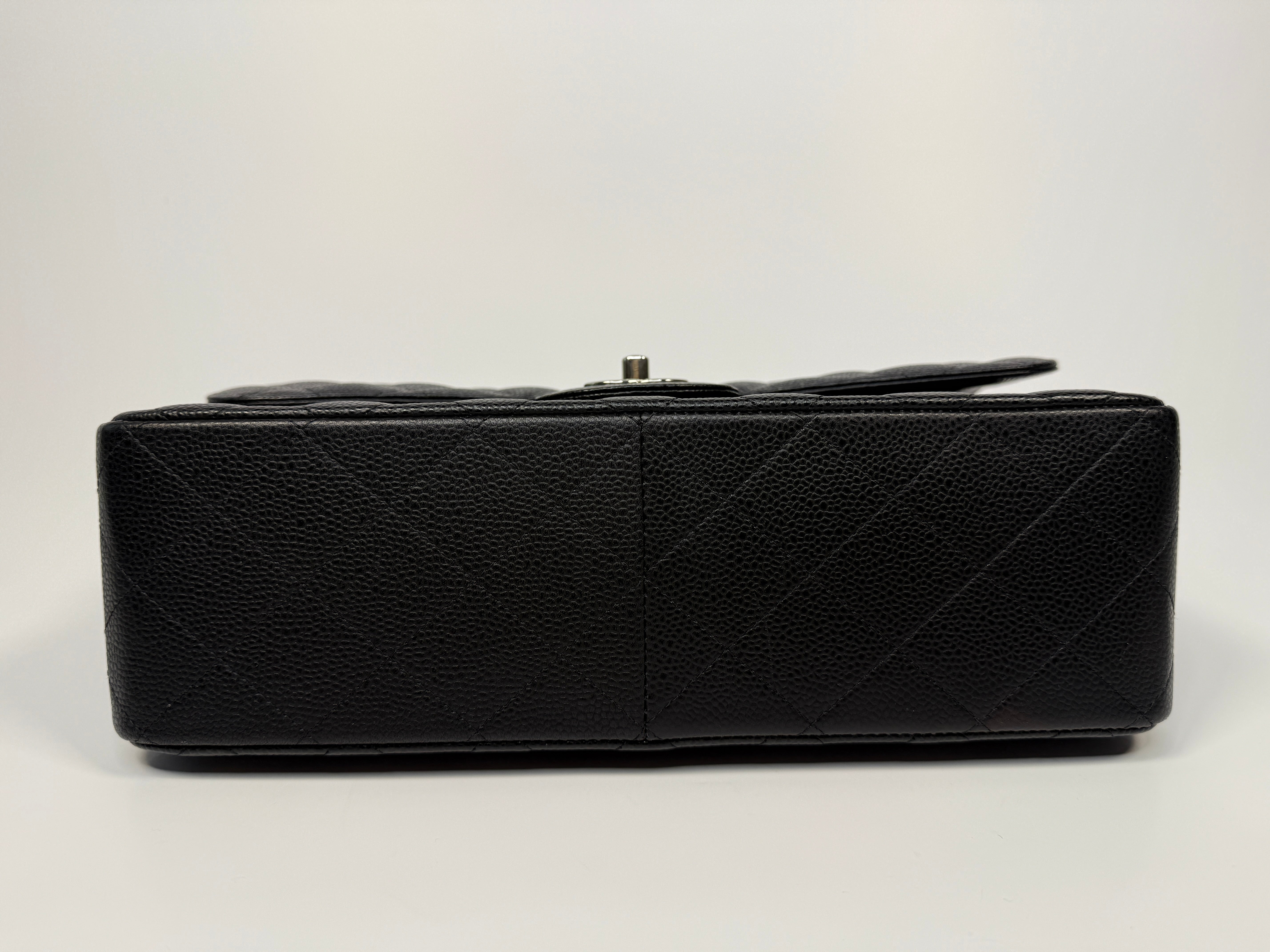 Chanel Classic Jumbo Flap Bag In Black Caviar Leather With Silver Hardware. Authentic and preloved. Excellent condition.