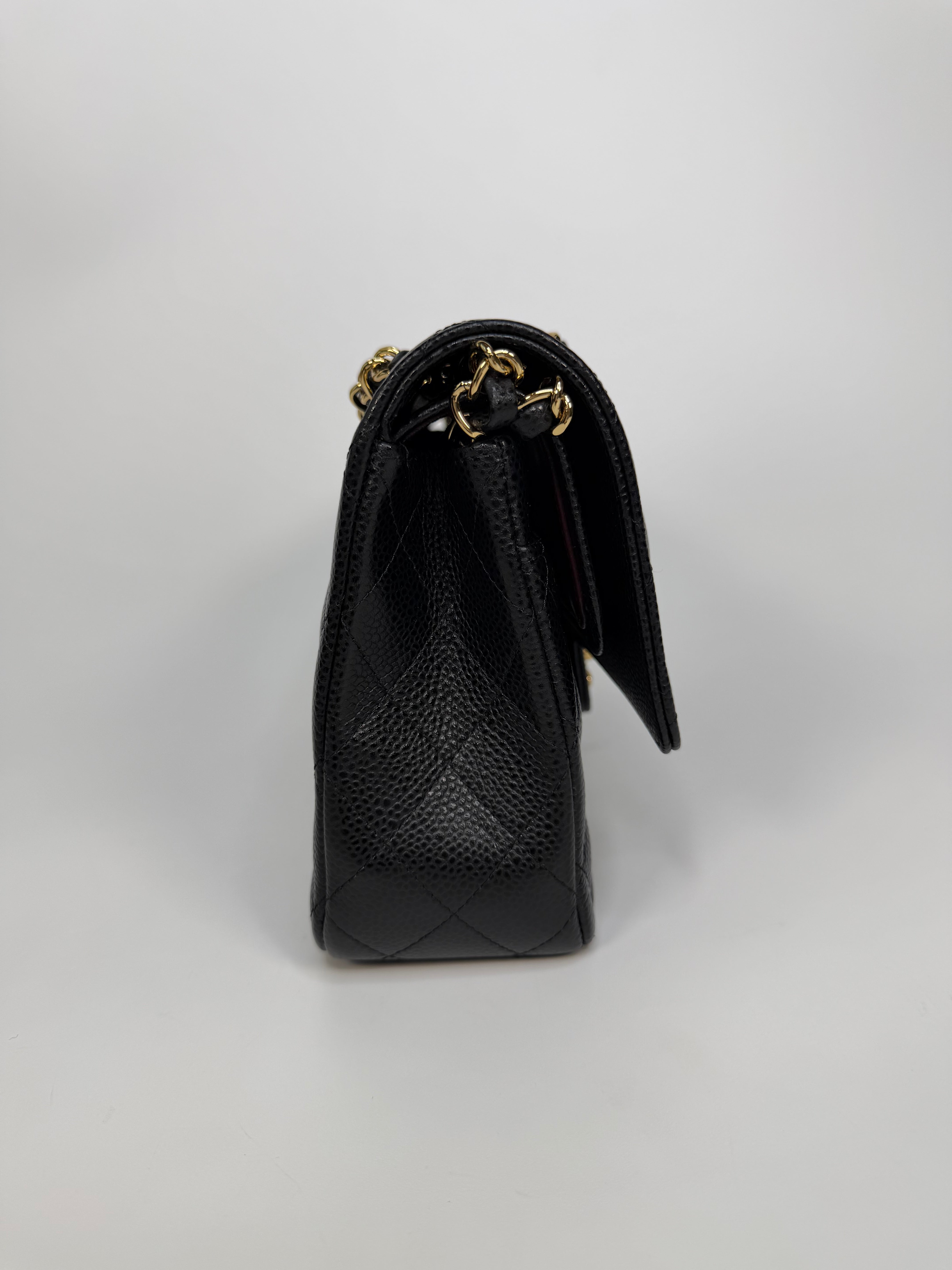 Chanel Medium Classic Double Flap In Black Caviar With Gold Hardware. Authentic and preloved in new and unused condition.