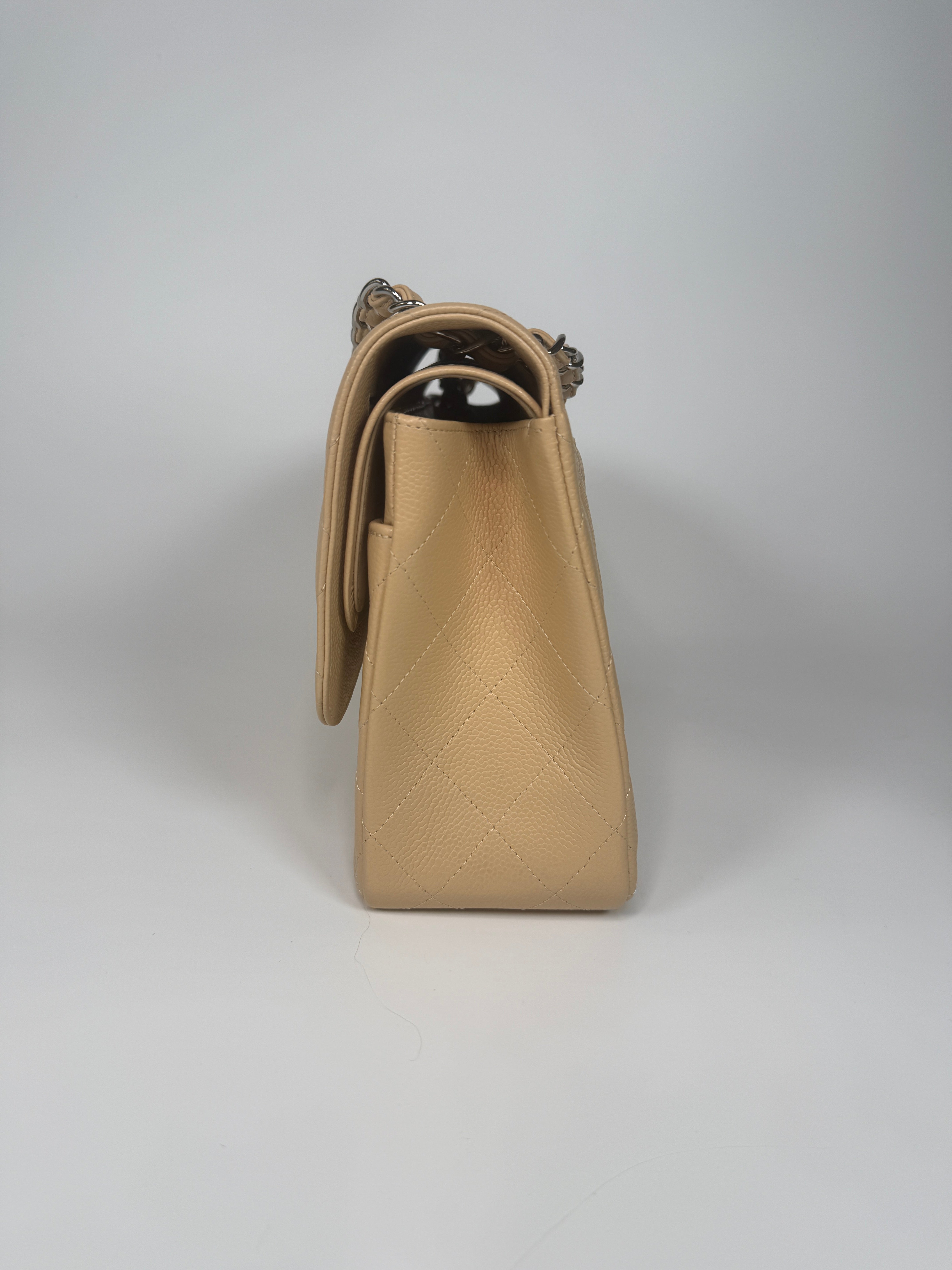Authentic and preloved Chanel Jumbo Classic Flap Bag In Beige Caviar Leather With Silver Hardware. 100% Authenticity guarantee. Verified by Luxe Cheshire. Fully Insured next day delivery