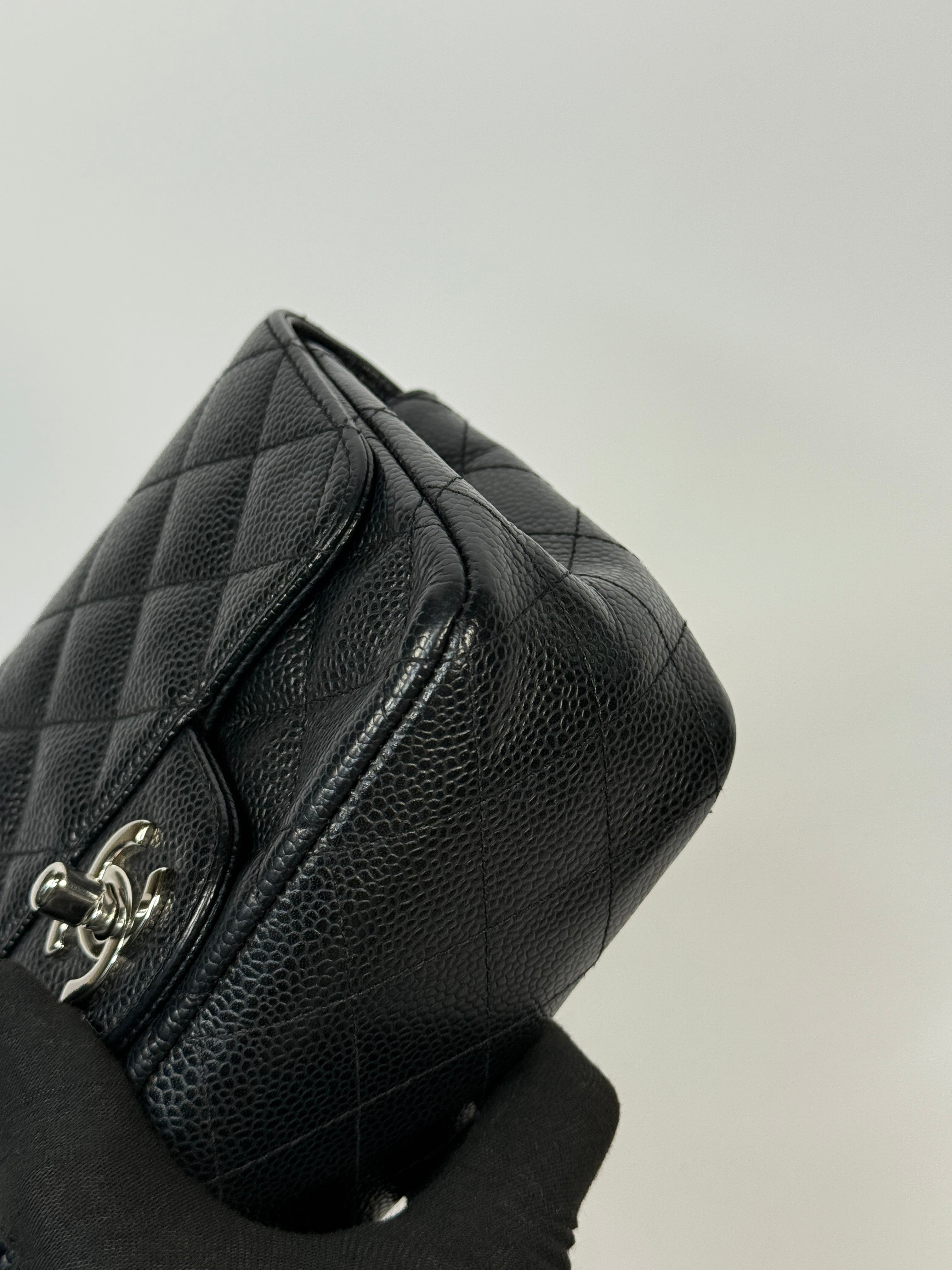 Chanel Black Square Flap Bag In Black Caviar Leather With Silver Hardware. Excellent condition. Authentic and preloved.