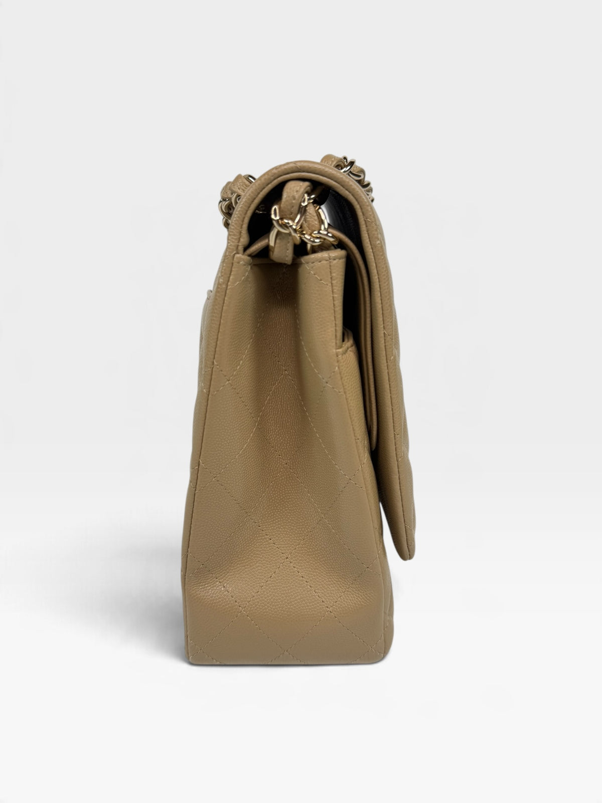 Chanel Maxi Flap In Beige Caviar Leather With Gold Hardware. 100% authentic and pre loved in excellent condition.