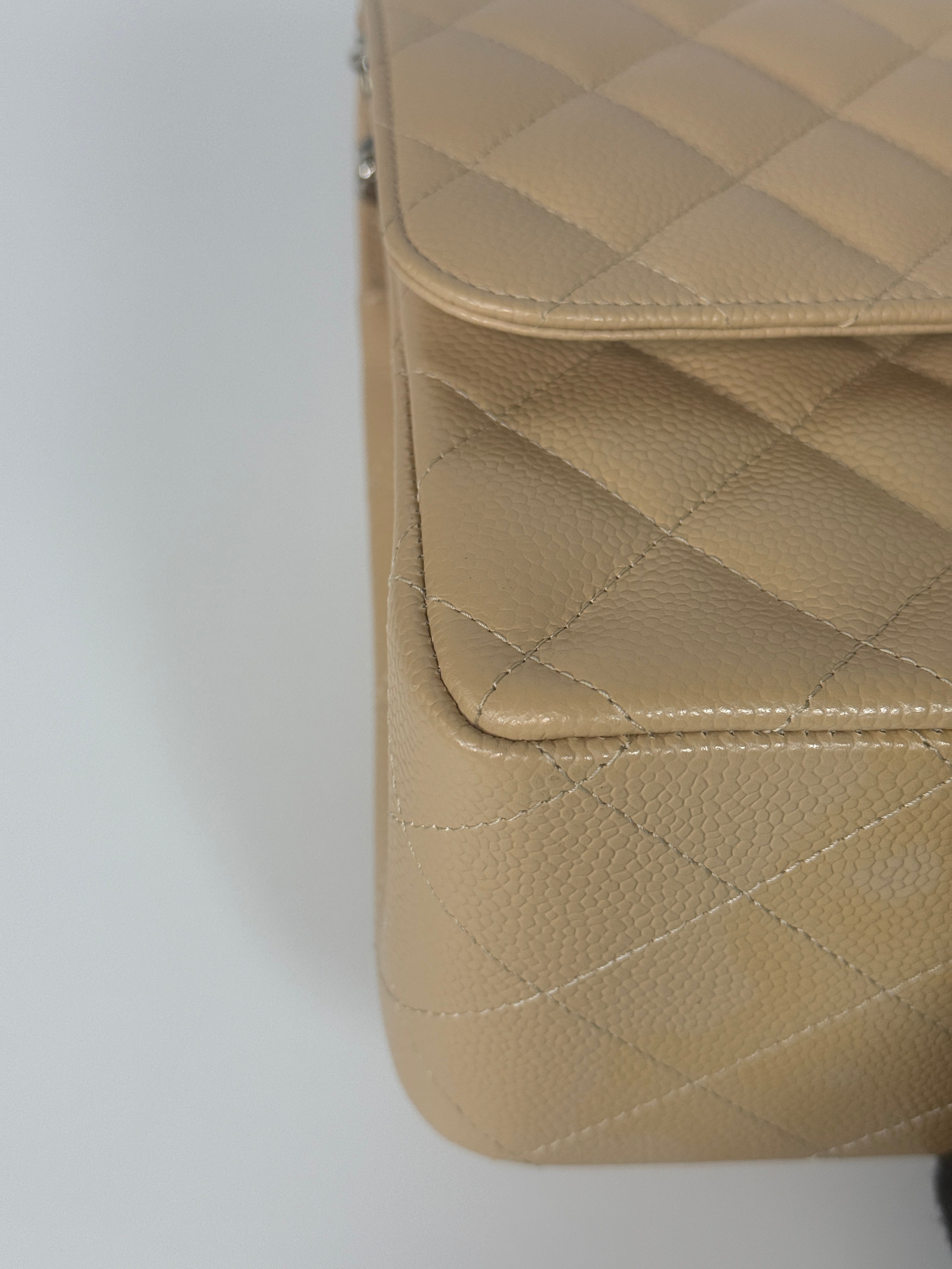 Authentic and preloved Chanel Jumbo Classic Flap Bag In Beige Caviar Leather With Silver Hardware. 100% Authenticity guarantee. Verified by Luxe Cheshire. Fully Insured next day delivery
