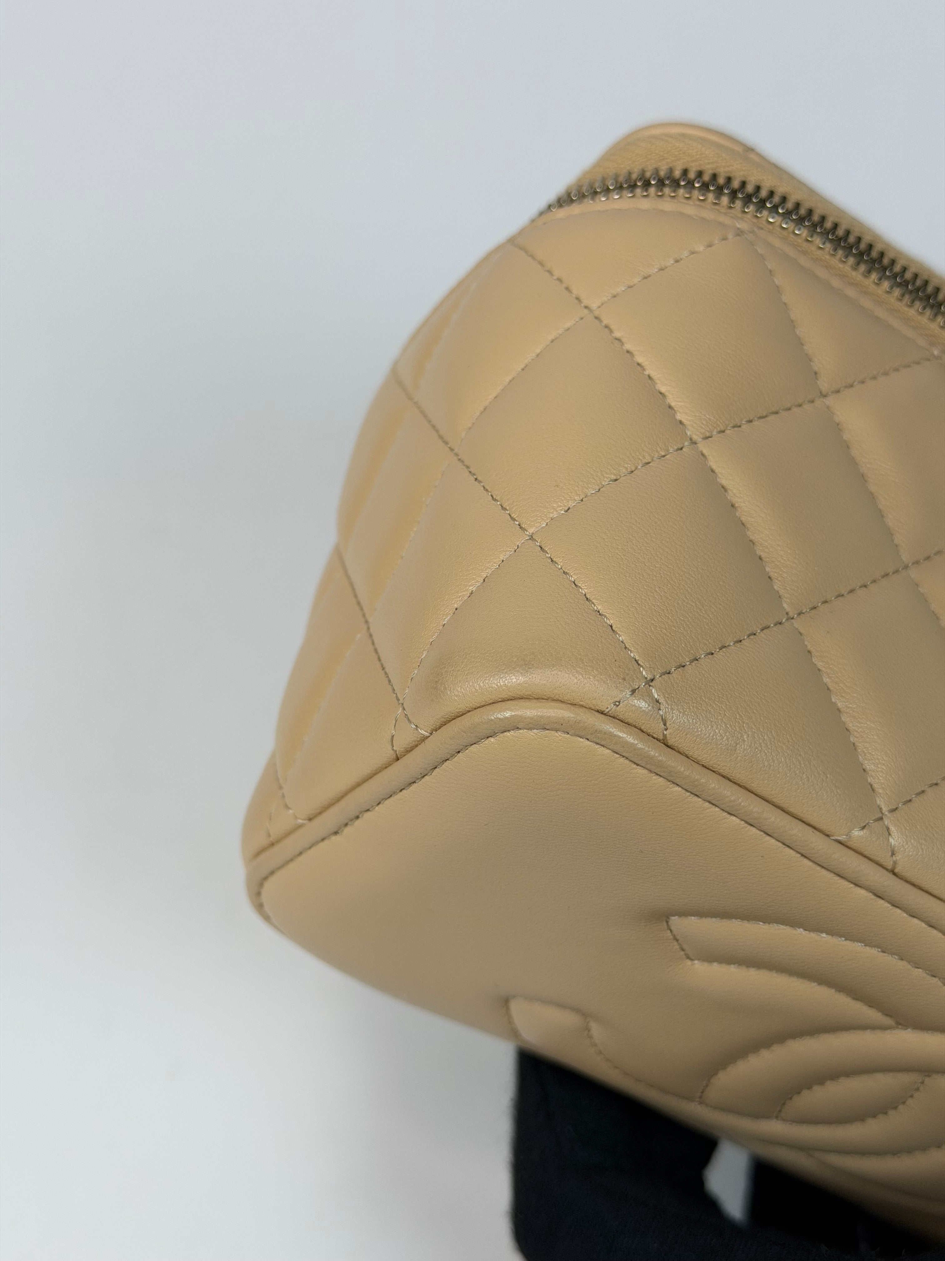 Chanel Mini Vanity Top Handle In Light Beige Lambskin Leather With Gold Hardware. Authentic and preloved in excellent condition. Insured next day delivery. Verified by Luxe Cheshire
