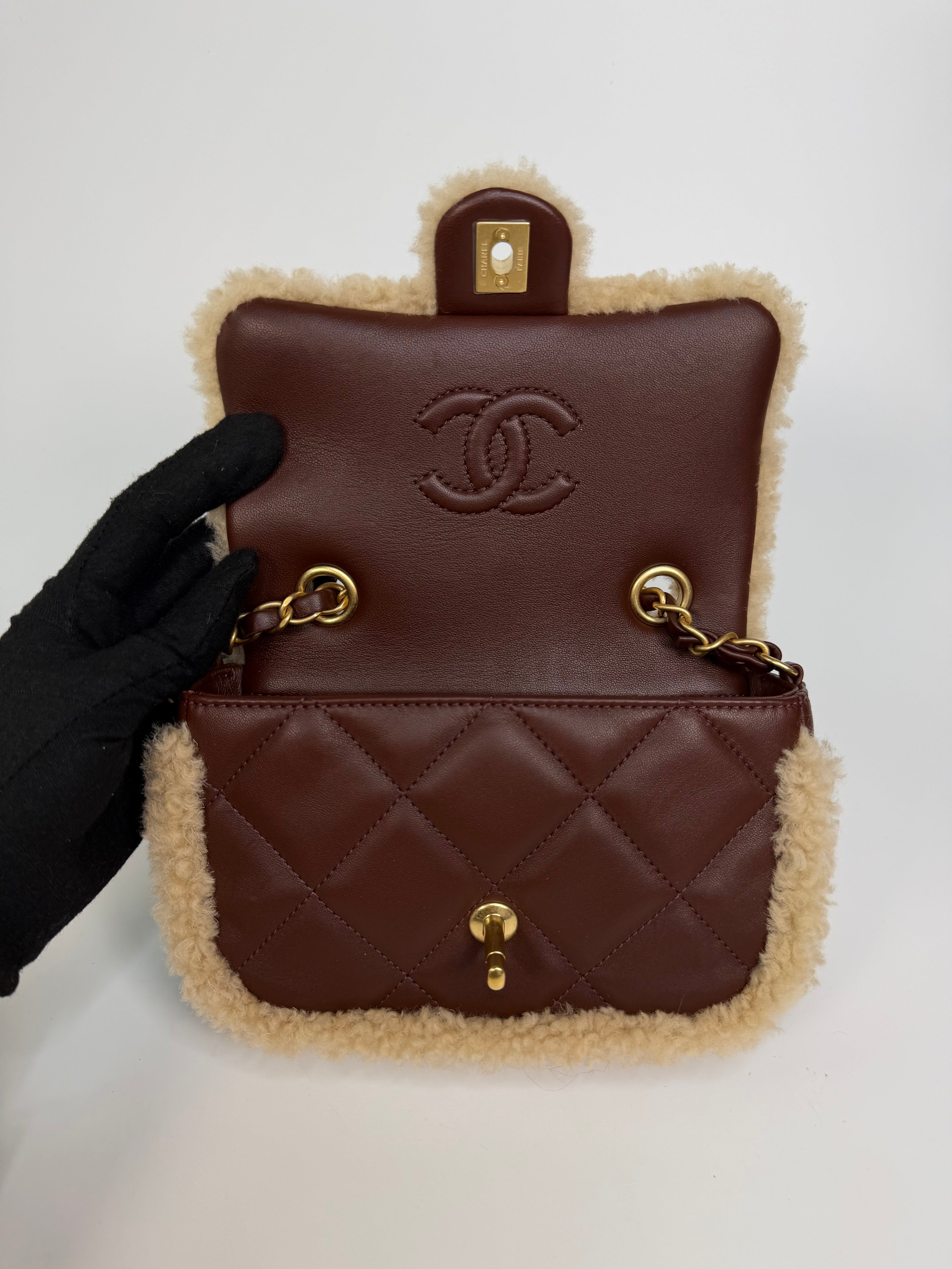 Chanel Mini Rectangle In Brown Lambskin Leather & Shearling With Gold Hardware. Authentic and preloved in excellent condition with 100% authenticity guarantee.