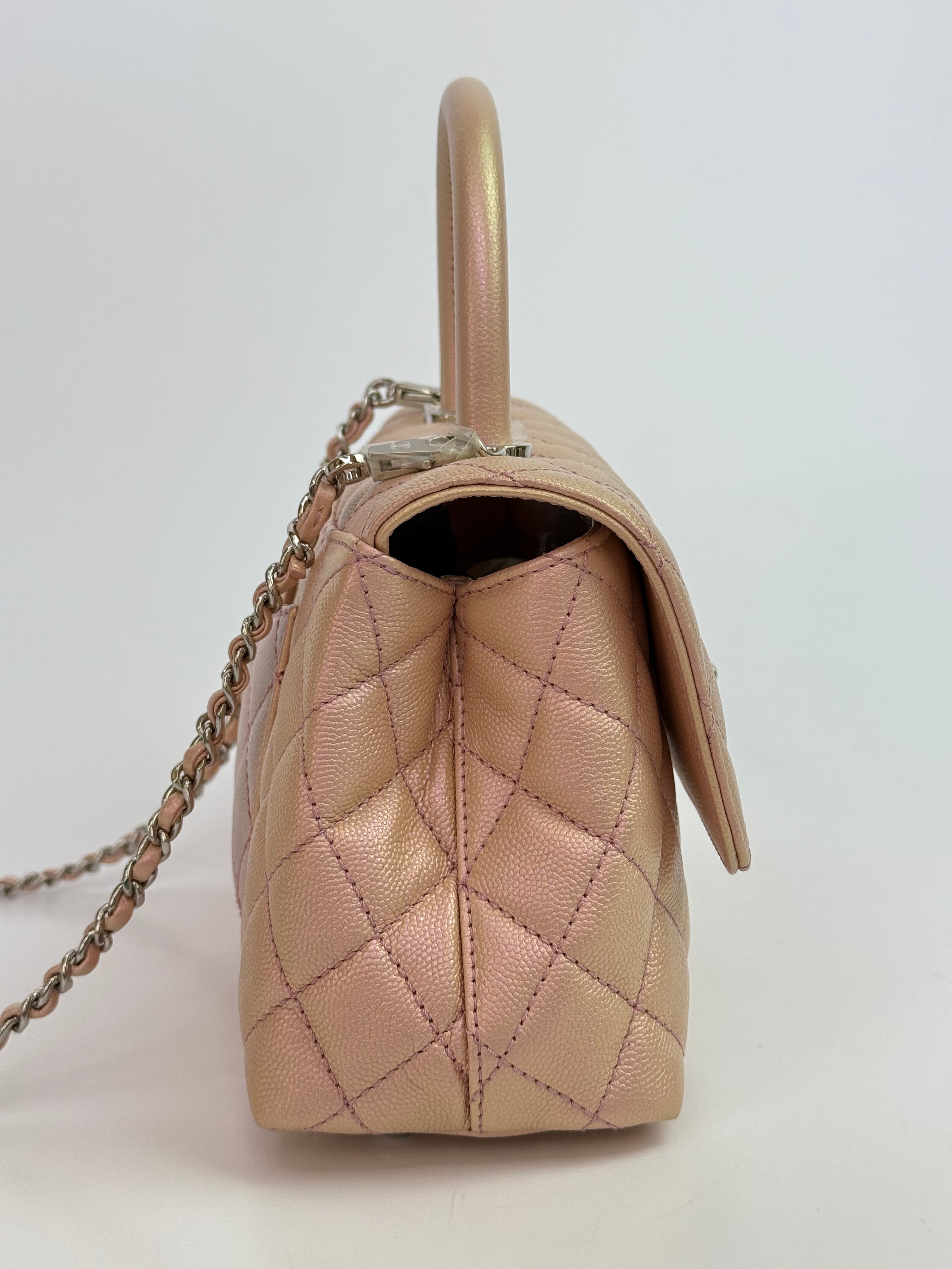 Authentic pre-loved Chanel Small Coco In Iridescent Pink Caviar With Rainbow Hardware.