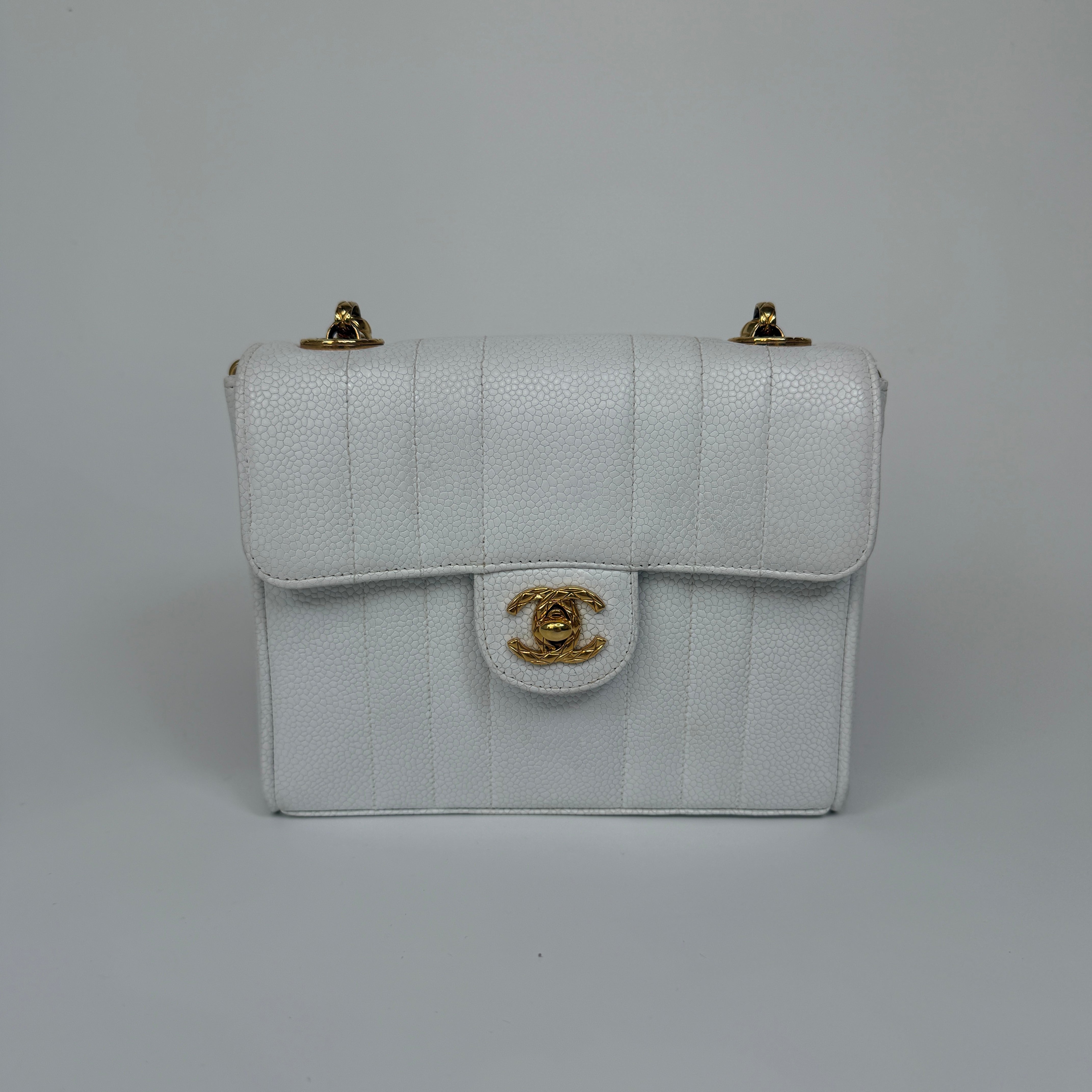 Chanel Vintage Mini Square Flap In White Caviar Leather With 24kt Gold Hardware. Excellent condition 100% Authenticity Guarantee