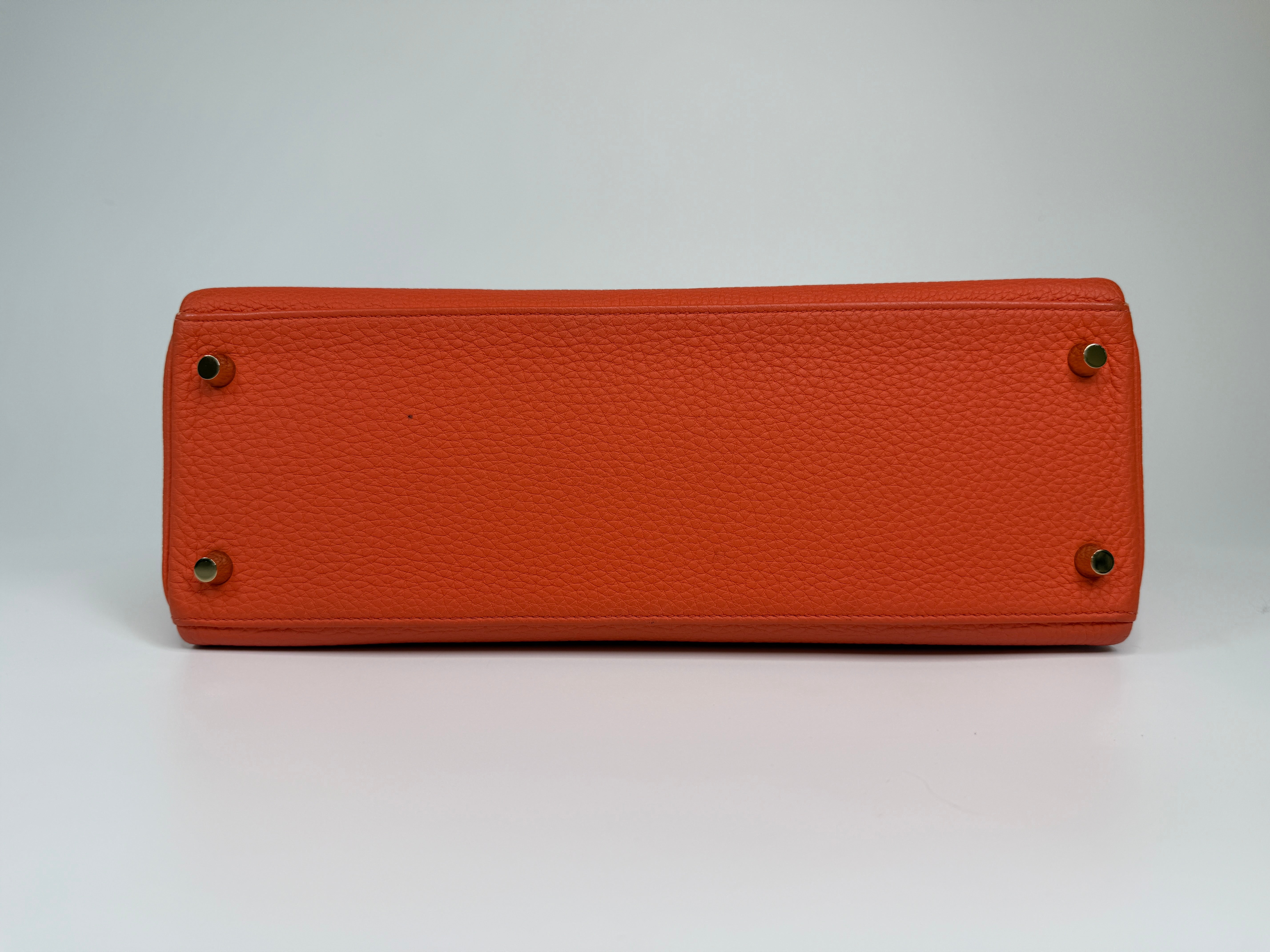 Authentic and preloved Hermès Kelly 28 In Cappucine Togo Leather Gold Hardware. Very Good Condition. 100% Authenticity guarantee