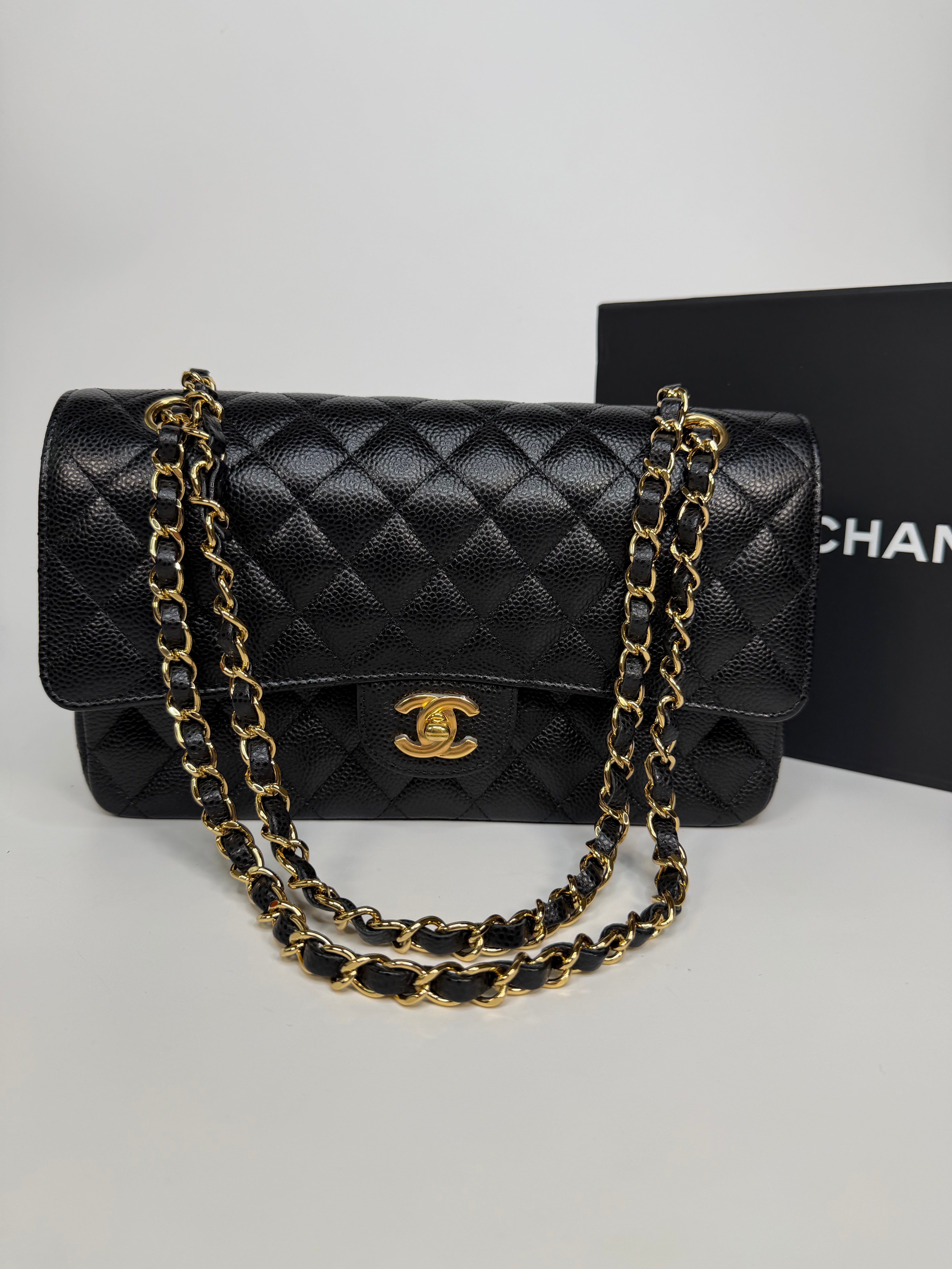 Chanel Medium Classic Double Flap In Black Caviar With Gold Hardware. Authentic and preloved in new and unused condition.