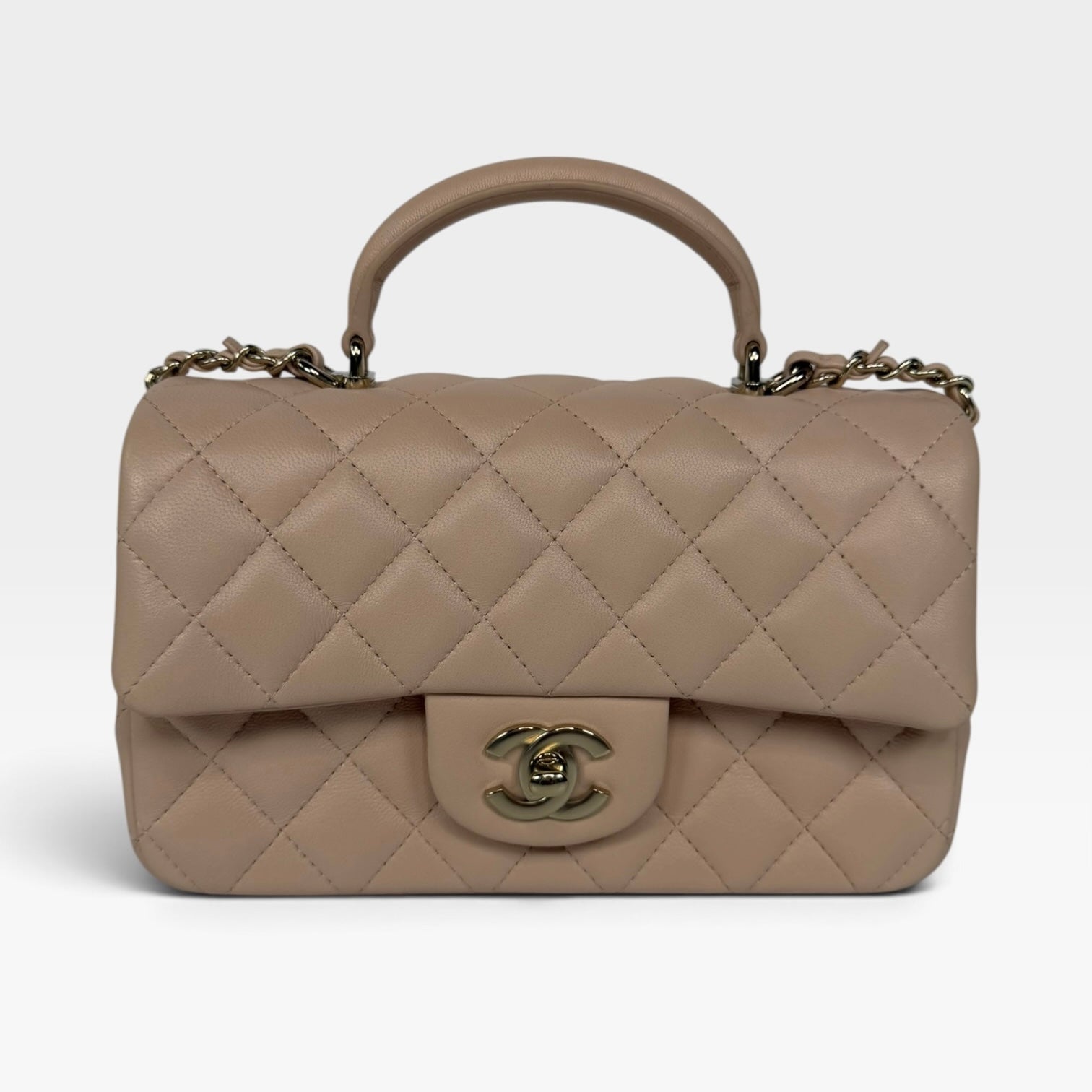 Chanel Mini Rectangle Top Handle Beige Lambskin Pale Gold Hardware. 100% authentic and preloved in excellent condition.