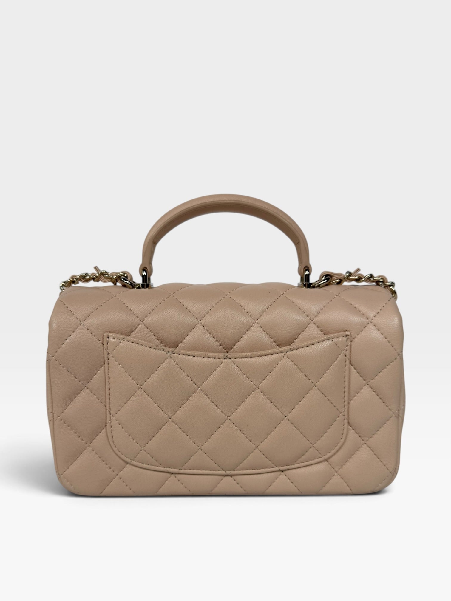 Chanel Mini Rectangle Top Handle Beige Lambskin Pale Gold Hardware. 100% authentic and preloved in excellent condition.