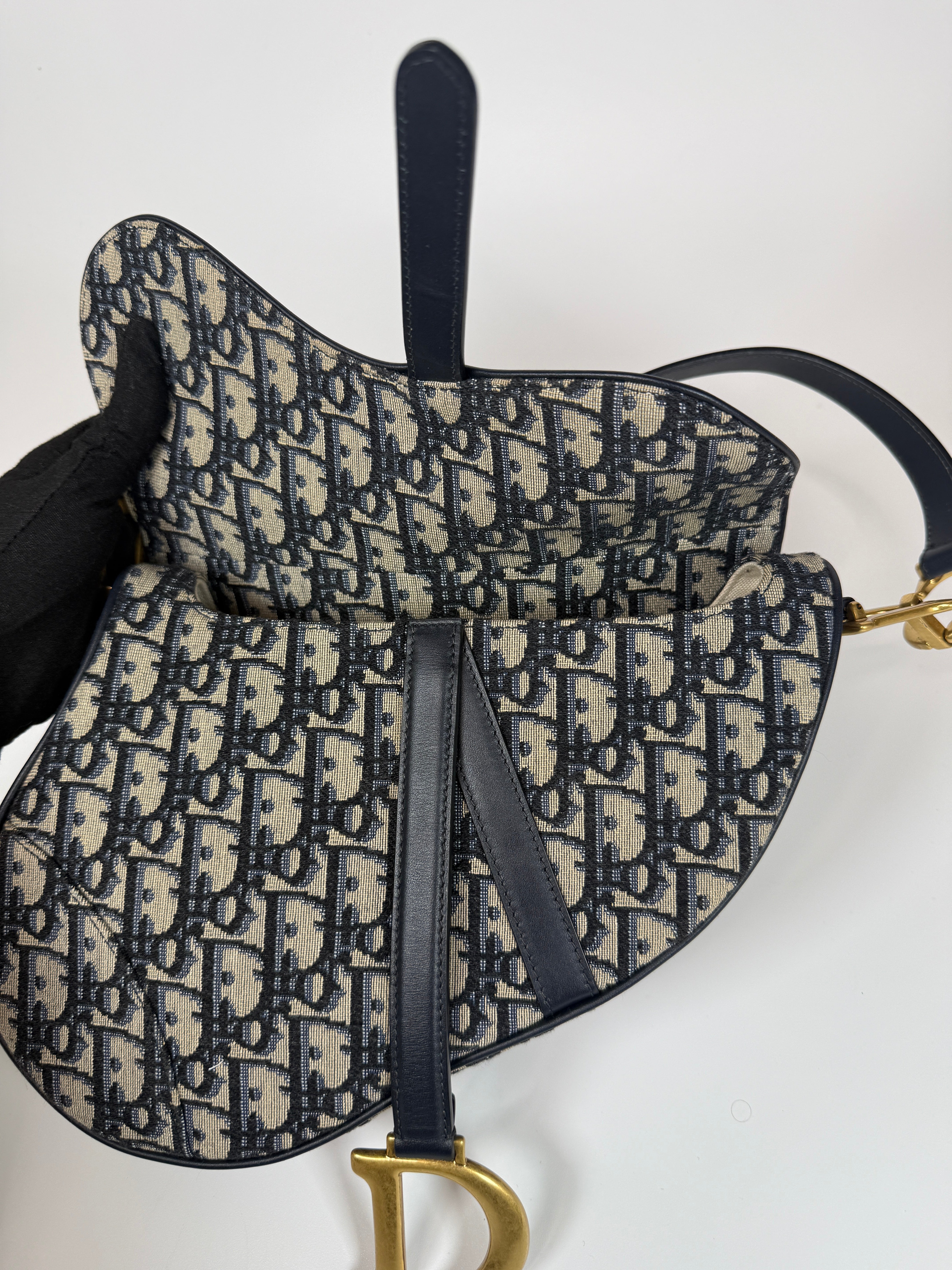 Authentic and preloved Christian Dior Saddle Bag In Oblique Canvas With Gold Hardware. Excellent condition. 100% Authenticity Guarantee
