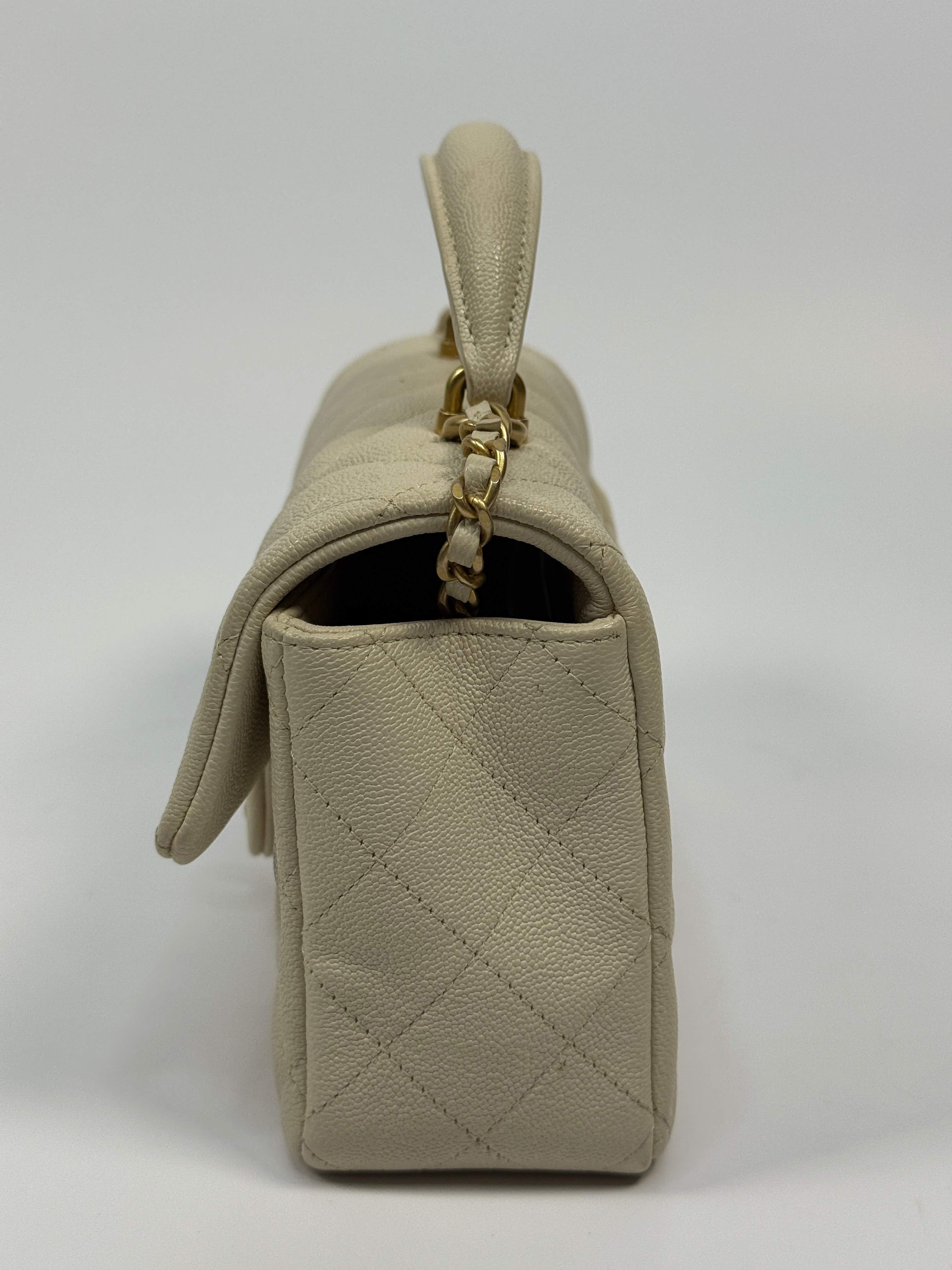 Chanel Mini Rectangle Top Handle In Ecru Caviar With Gold hardware, authentic and preloved in excellent condition