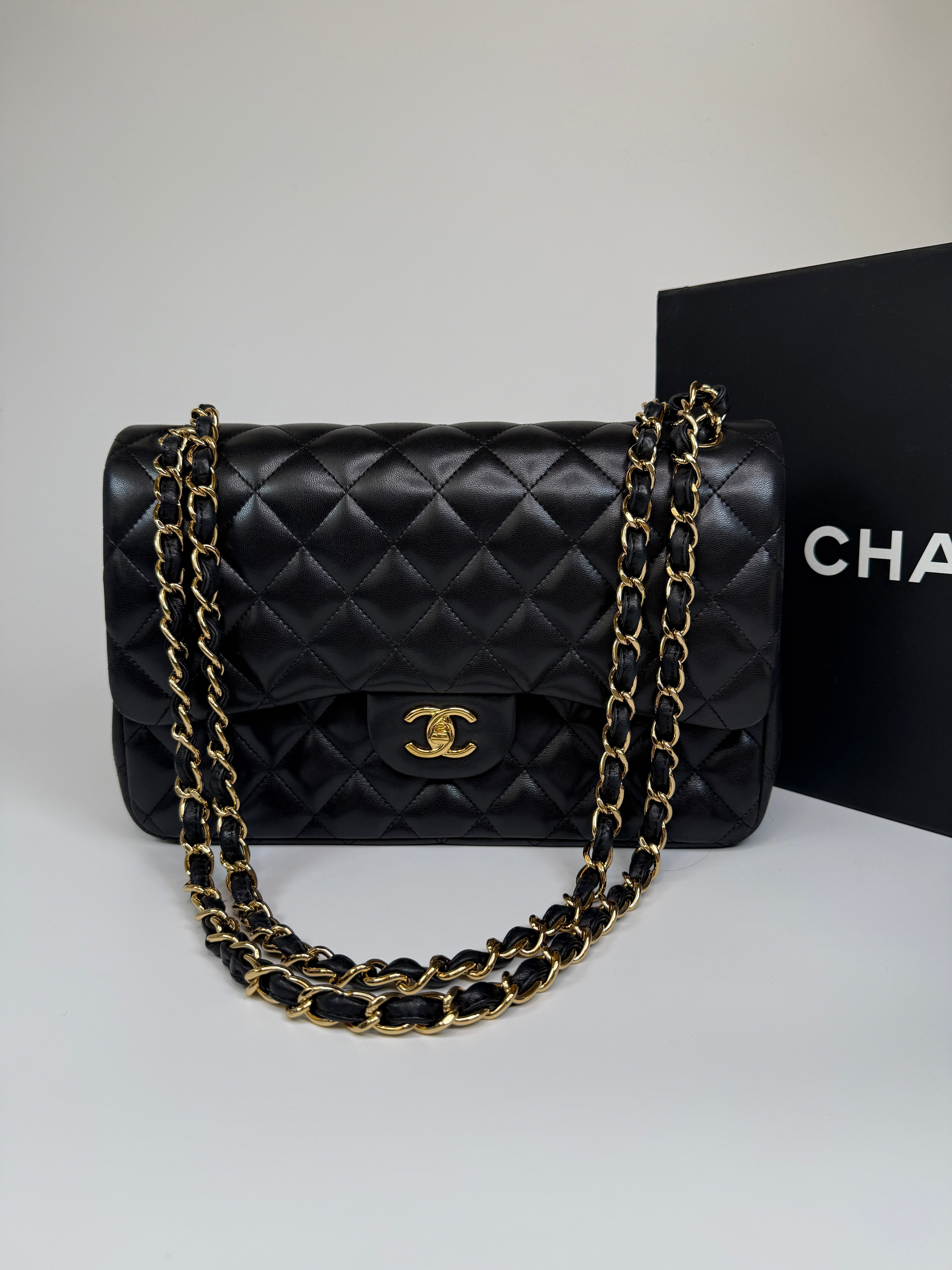 Authentic and preloved Chanel Jumbo Classic Flap Bag In Black Lambskin Leather With GOLD Hardware. Excellent condition. 100% Authenticity Guarantee